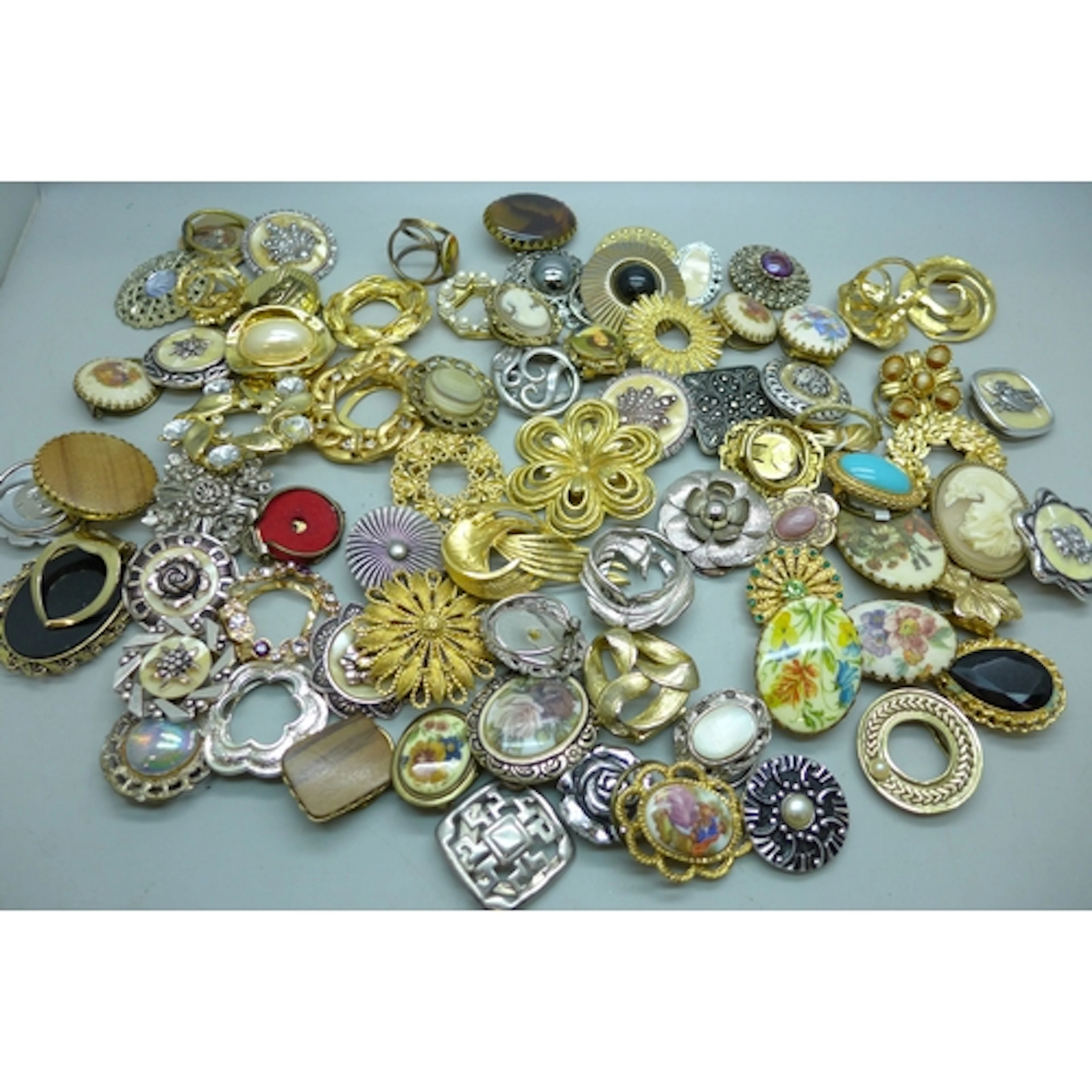 A collection of approximately 75 scarf clips and scarf rings