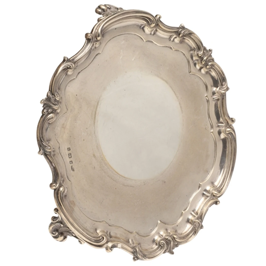 A LATE VICTORIAN/EARLY EDWARDIAN SILVER SALVER. Of shaped ro...