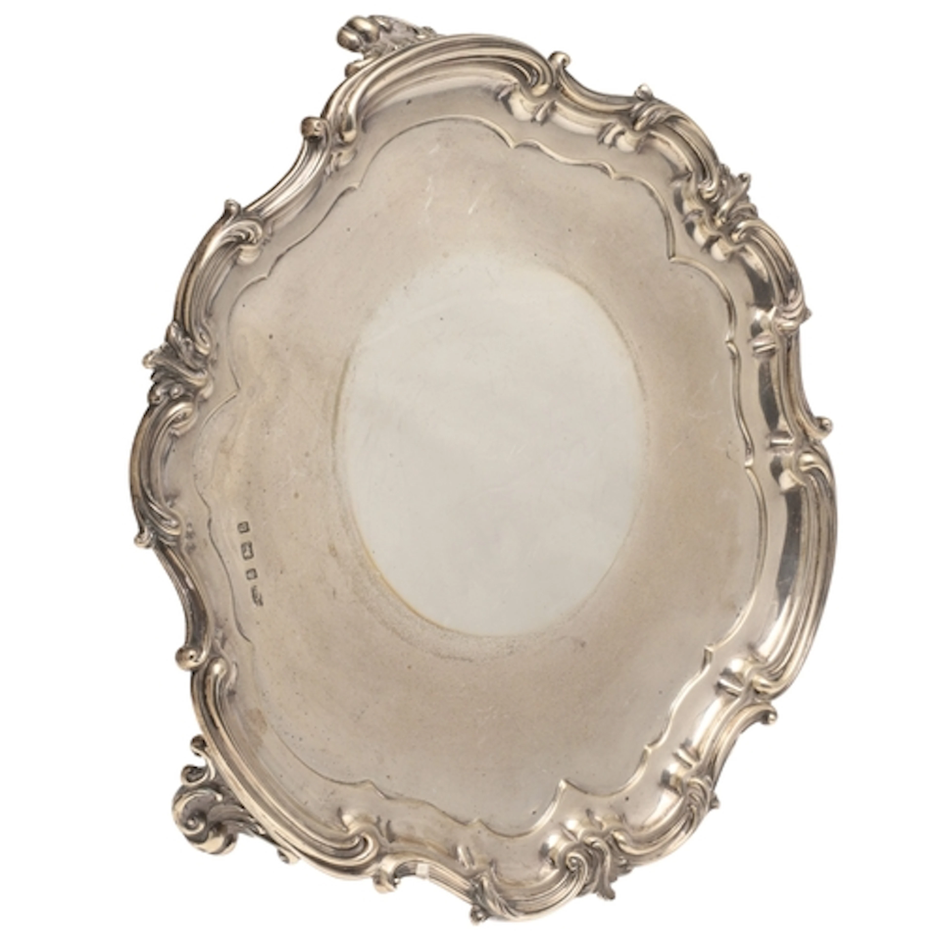 A LATE VICTORIAN/EARLY EDWARDIAN SILVER SALVER. Of shaped ro...