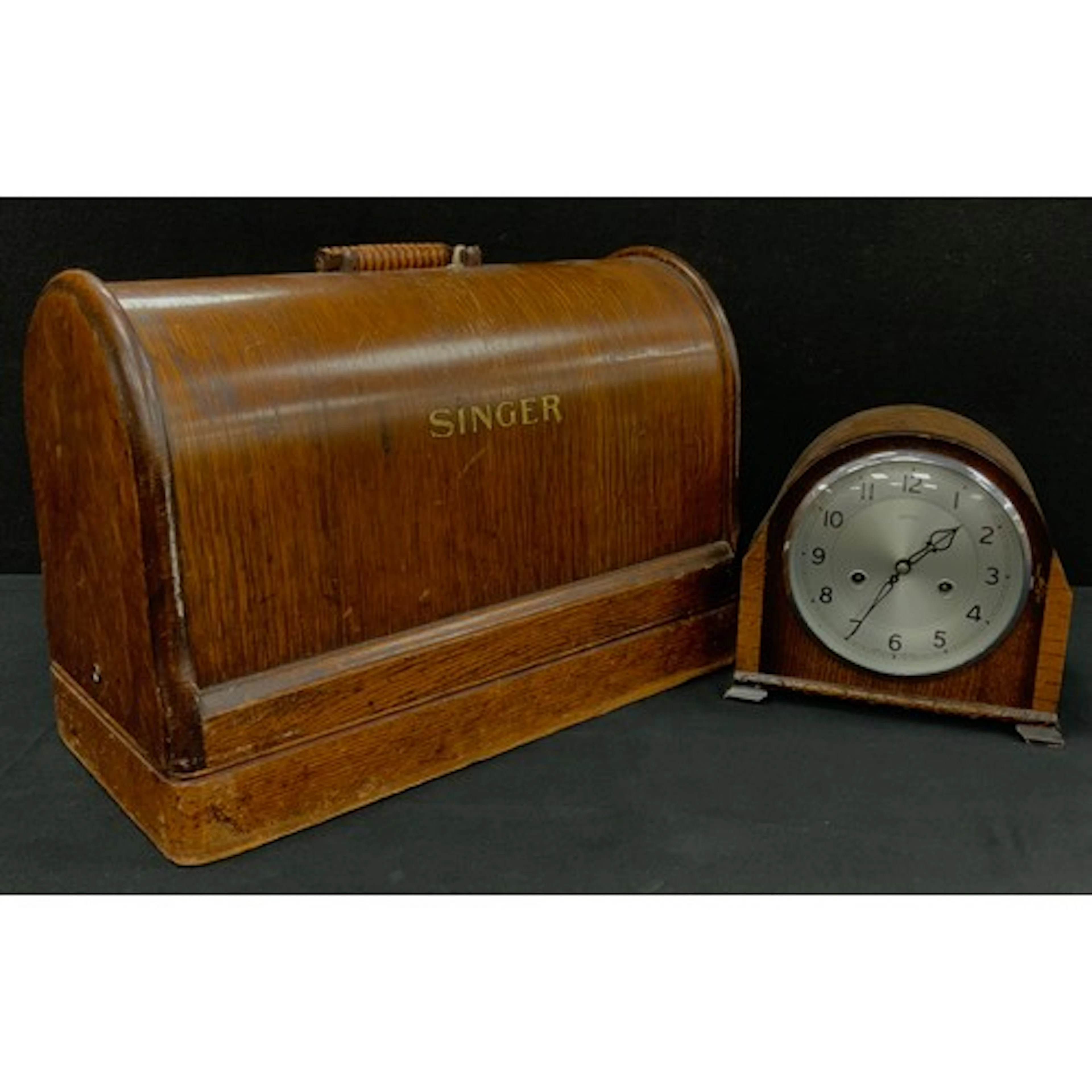 A vintage singer sewing machine, oak case; Smiths oak mante...