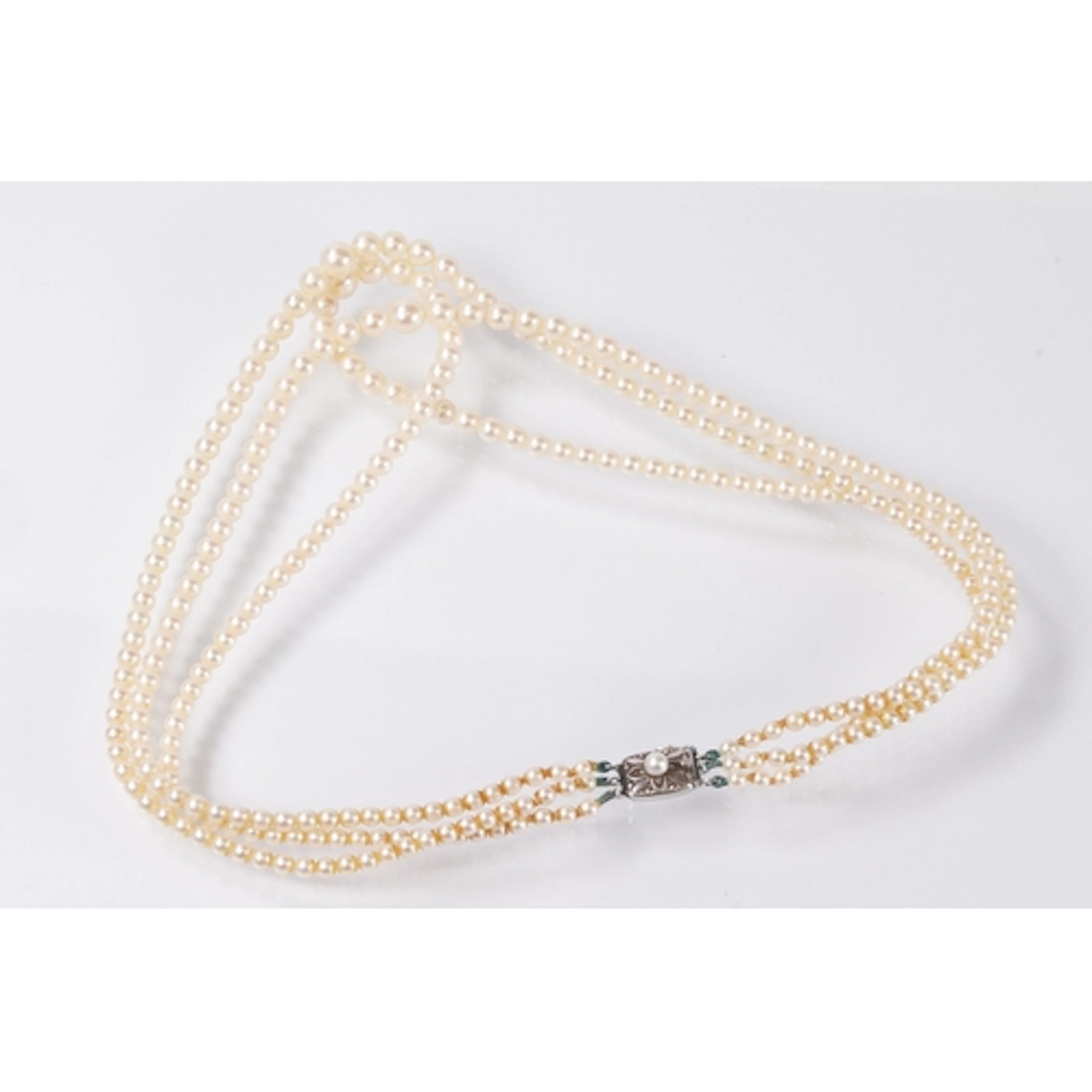 Mikimoto cultured pearl three strand necklace. Each strand i...
