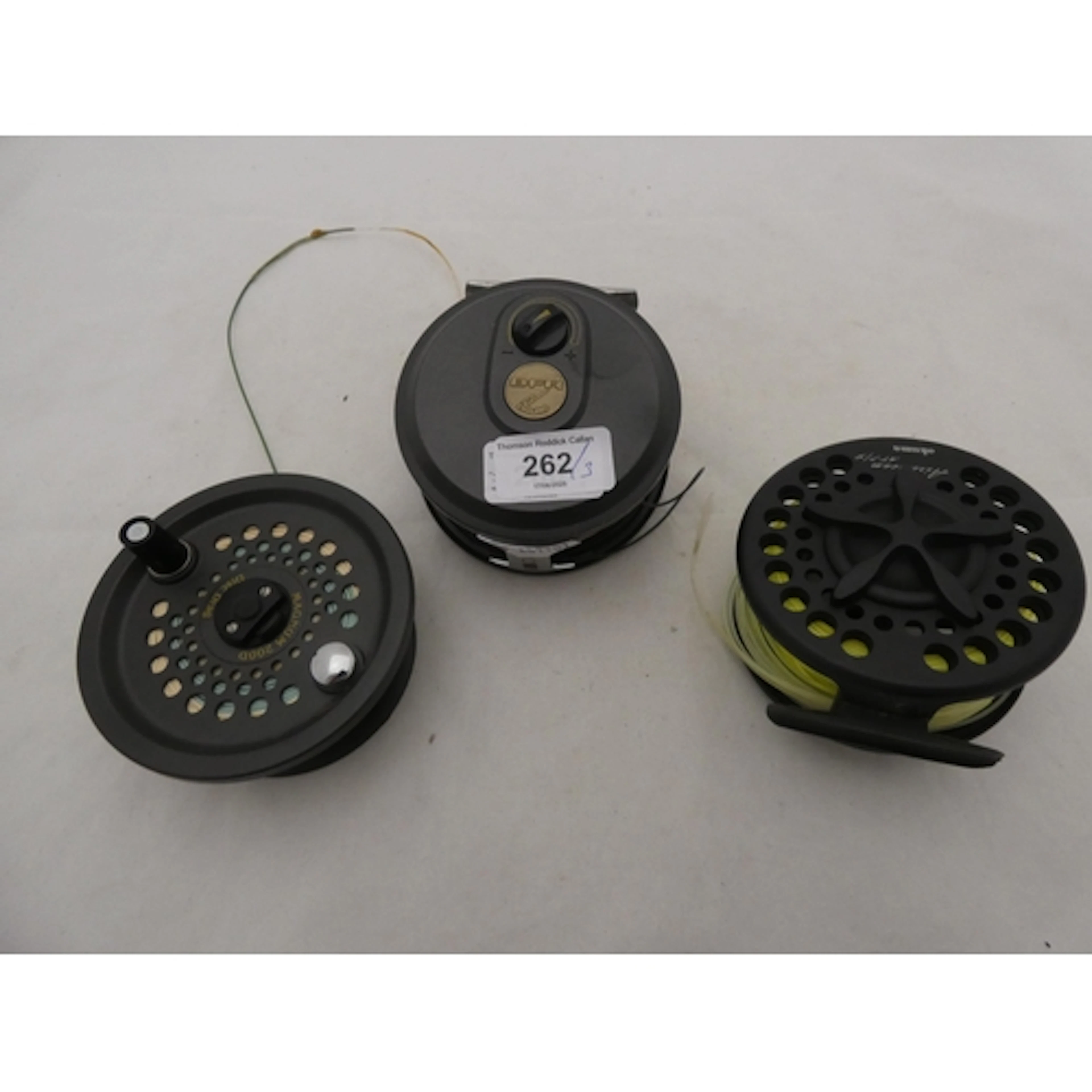 Three fishing reels to include Okuma Airstream AT77/9 and tw...