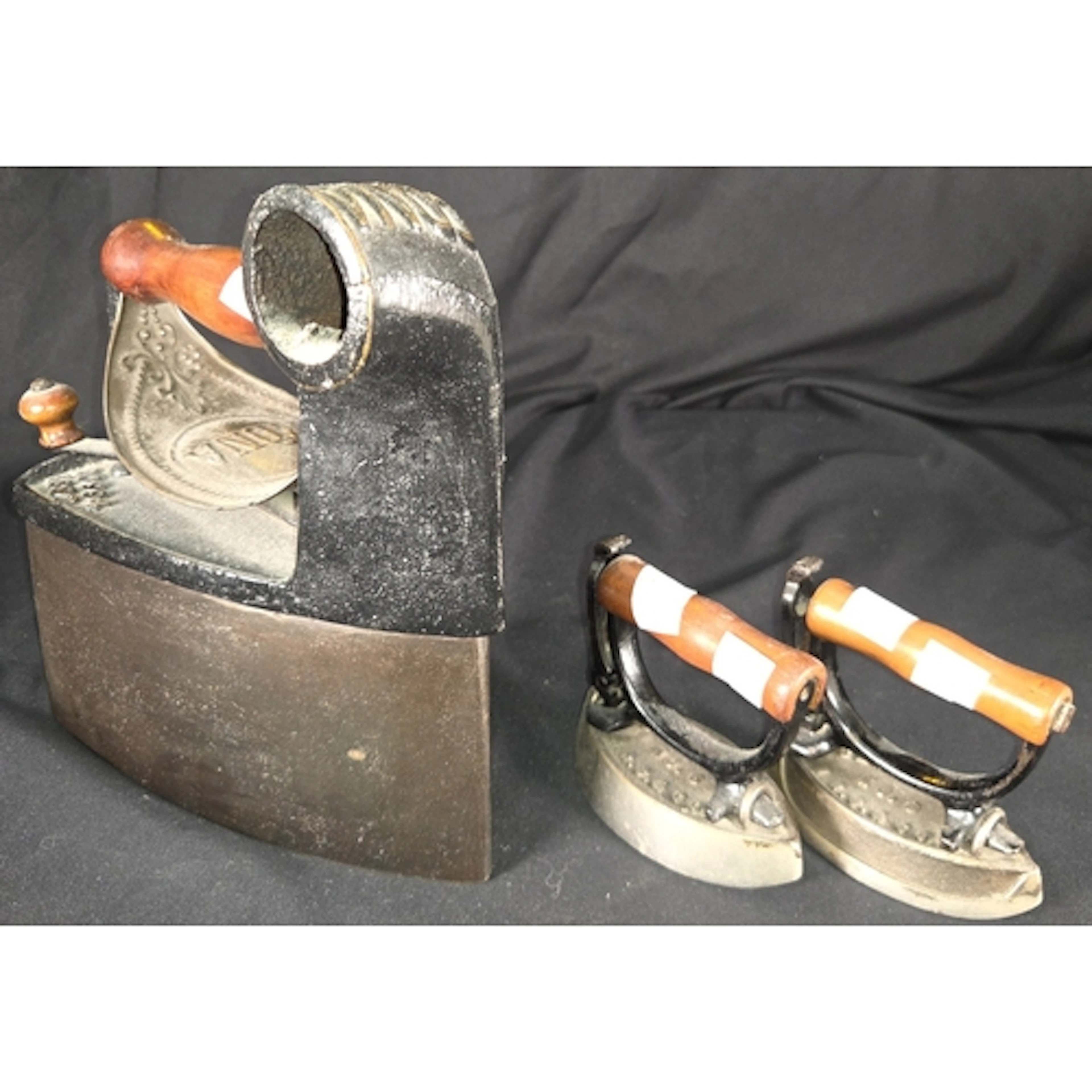 A 19th century Edna coal box smoothing iron, two Sensible Sa...