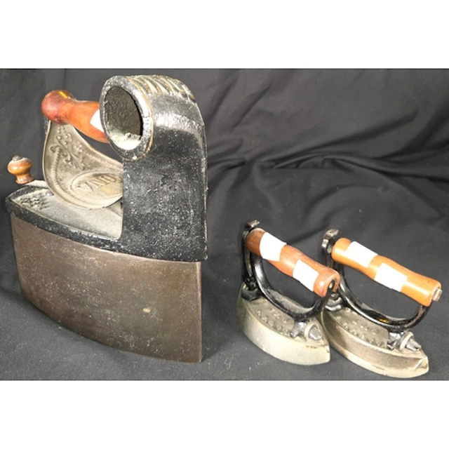 A 19th century Edna coal box smoothing iron, two Sensible Sa...