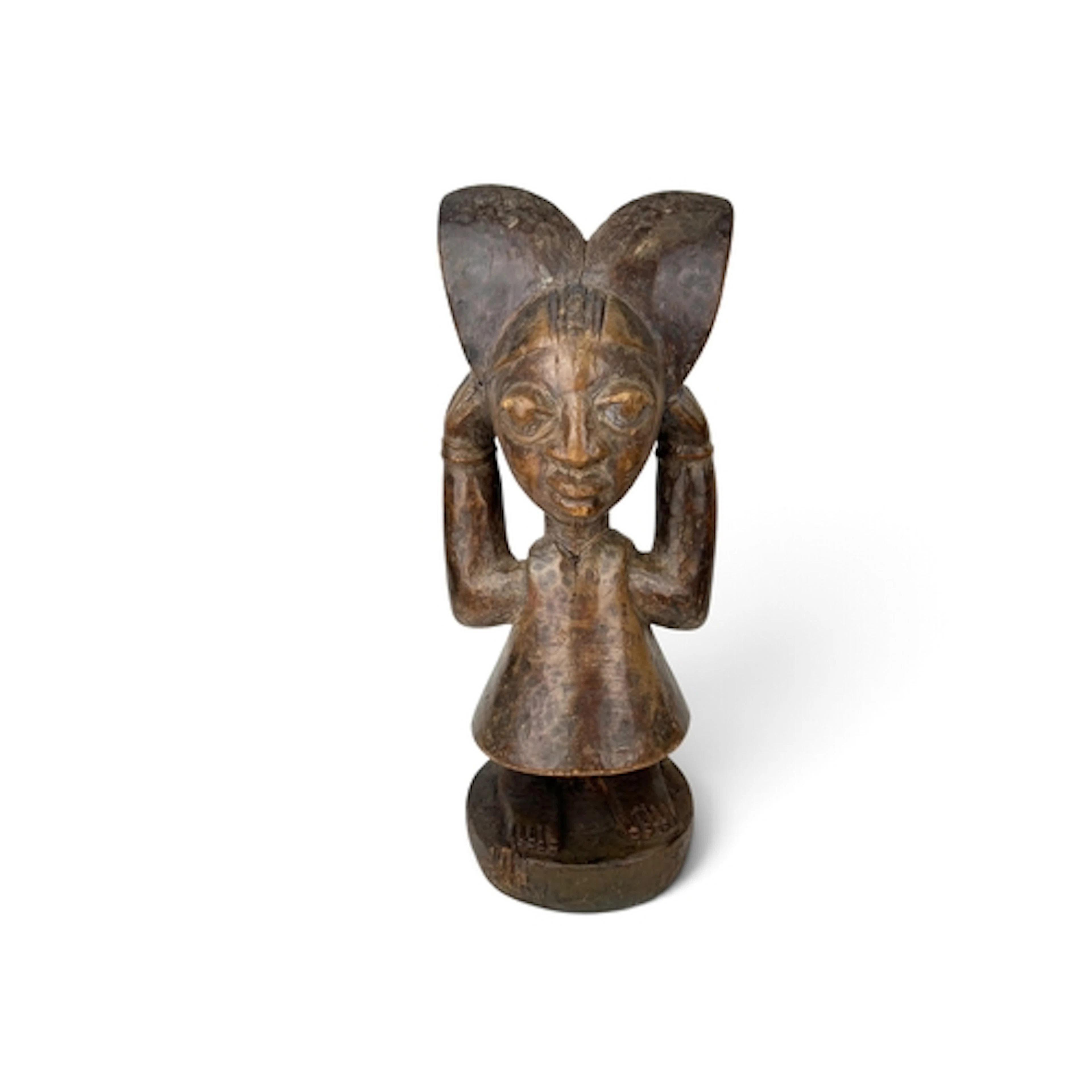 AN AFRICAN TRIBAL CARVED WOODEN SHRINE FIGURE, YORUBA In the...