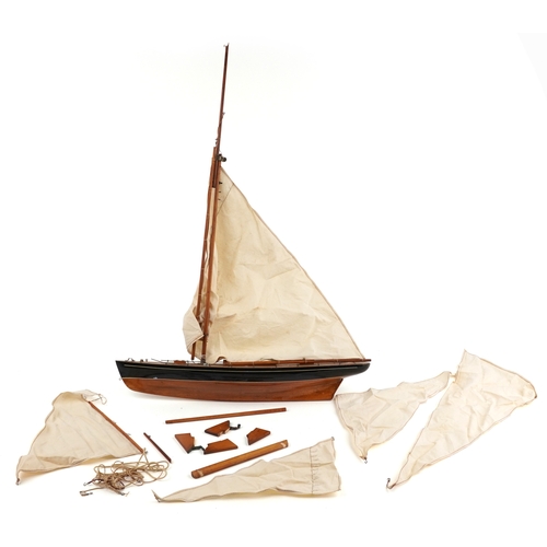 A 20th century scratch build model pond yacht with cloth sai...