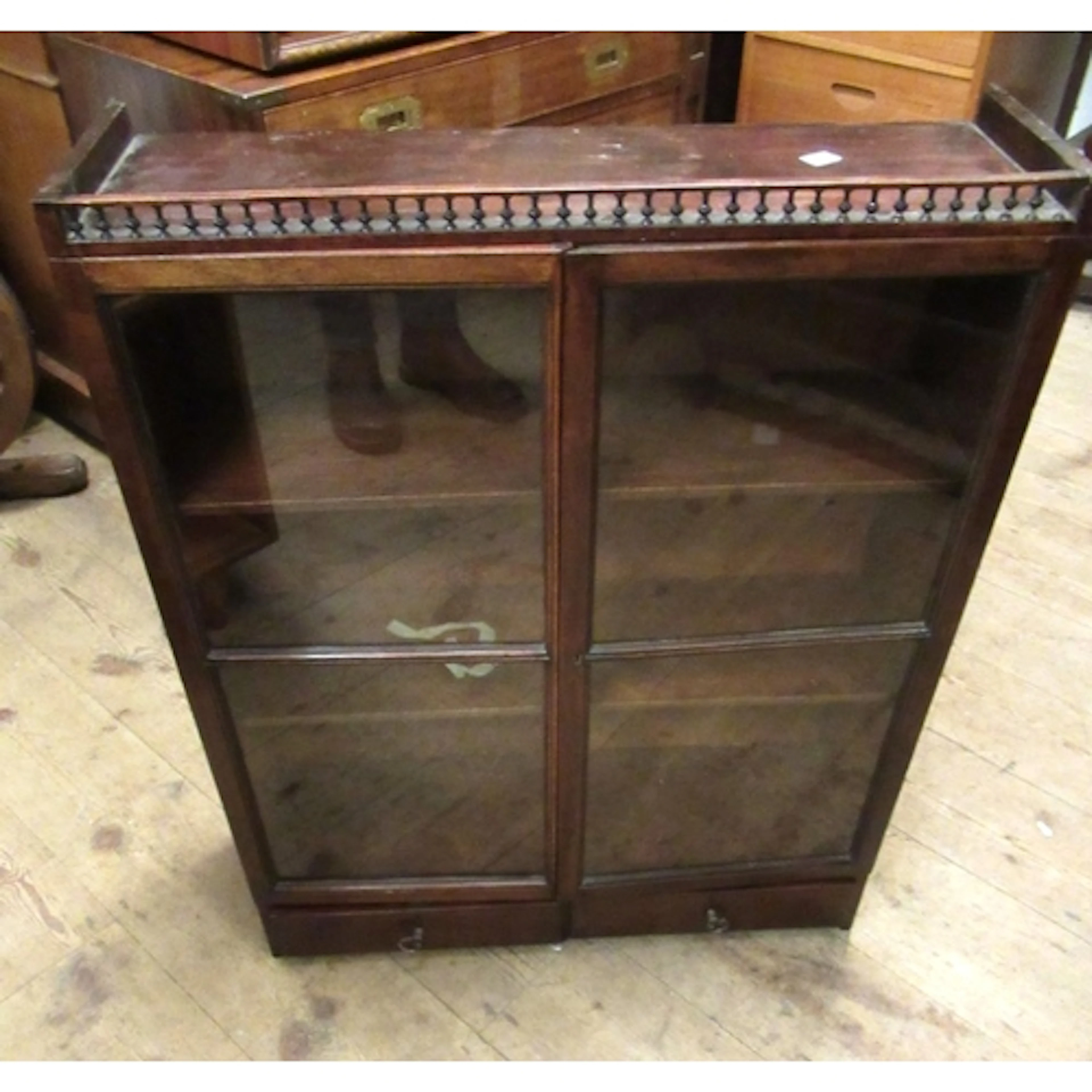 Late Victorian hanging bookcase, the galleried top above two...