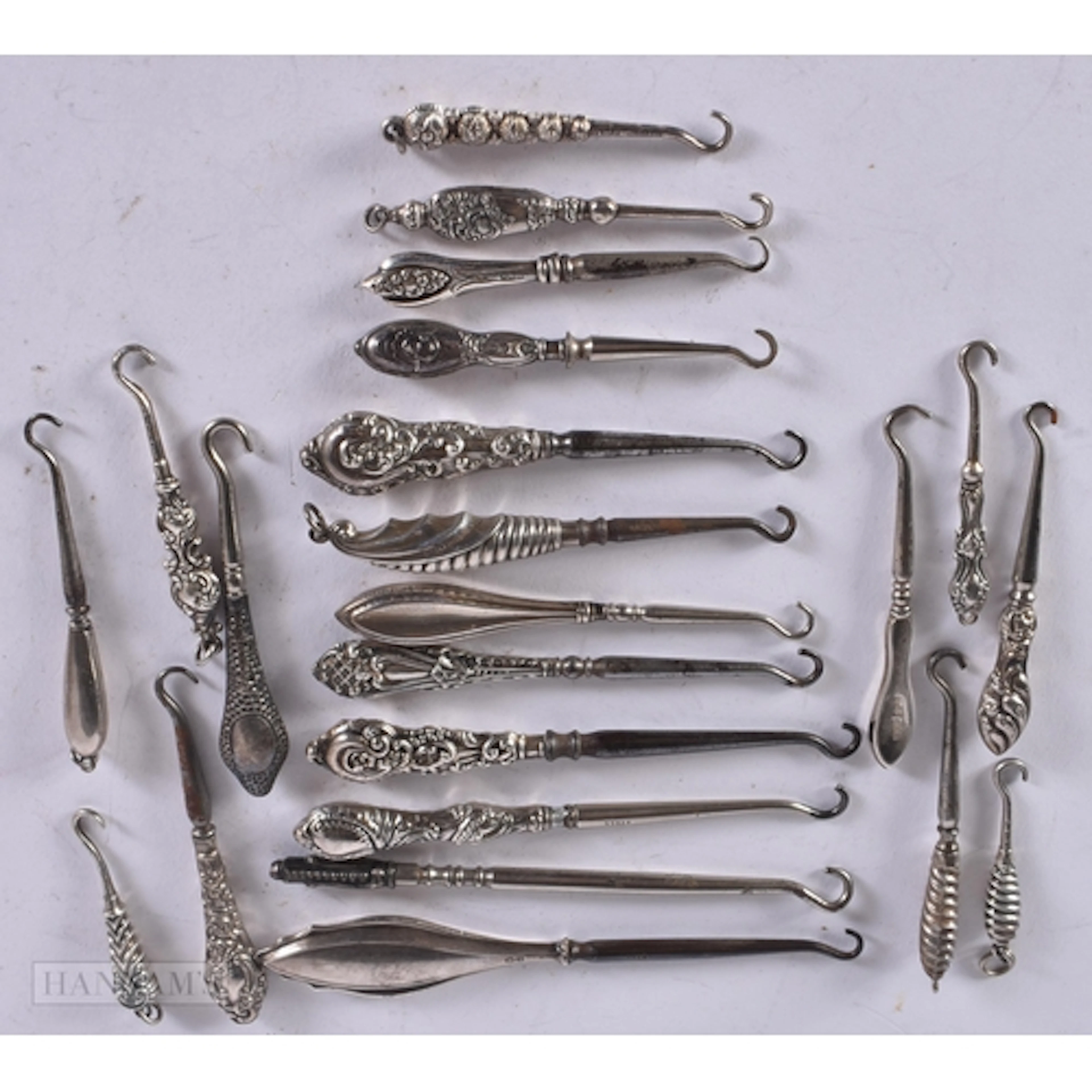 A GROUP OF SMALLER ANTIQUE SILVER HANDLED BUTTON HOOKS. 128 ...