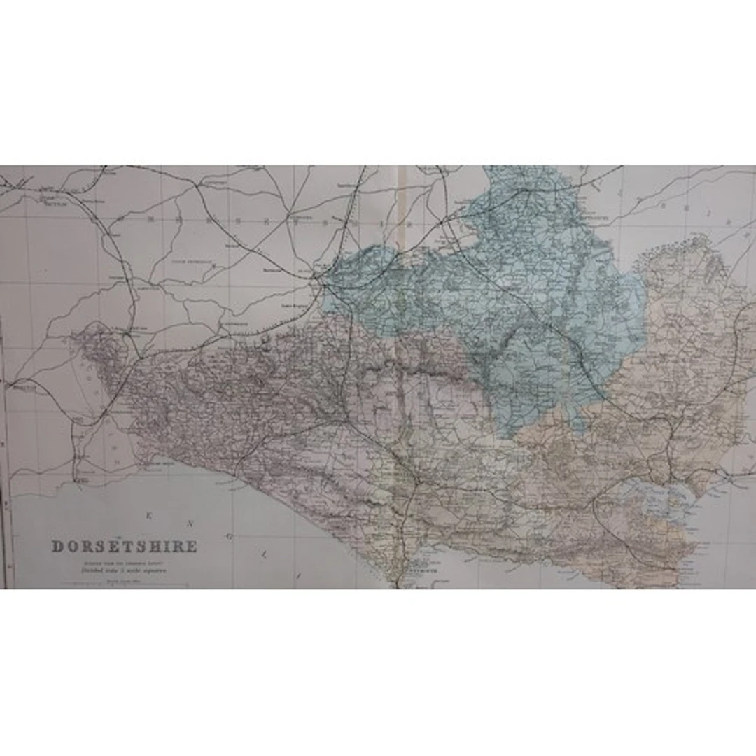 Framed late 19th century colour-printed map of Dorsetshire, ...