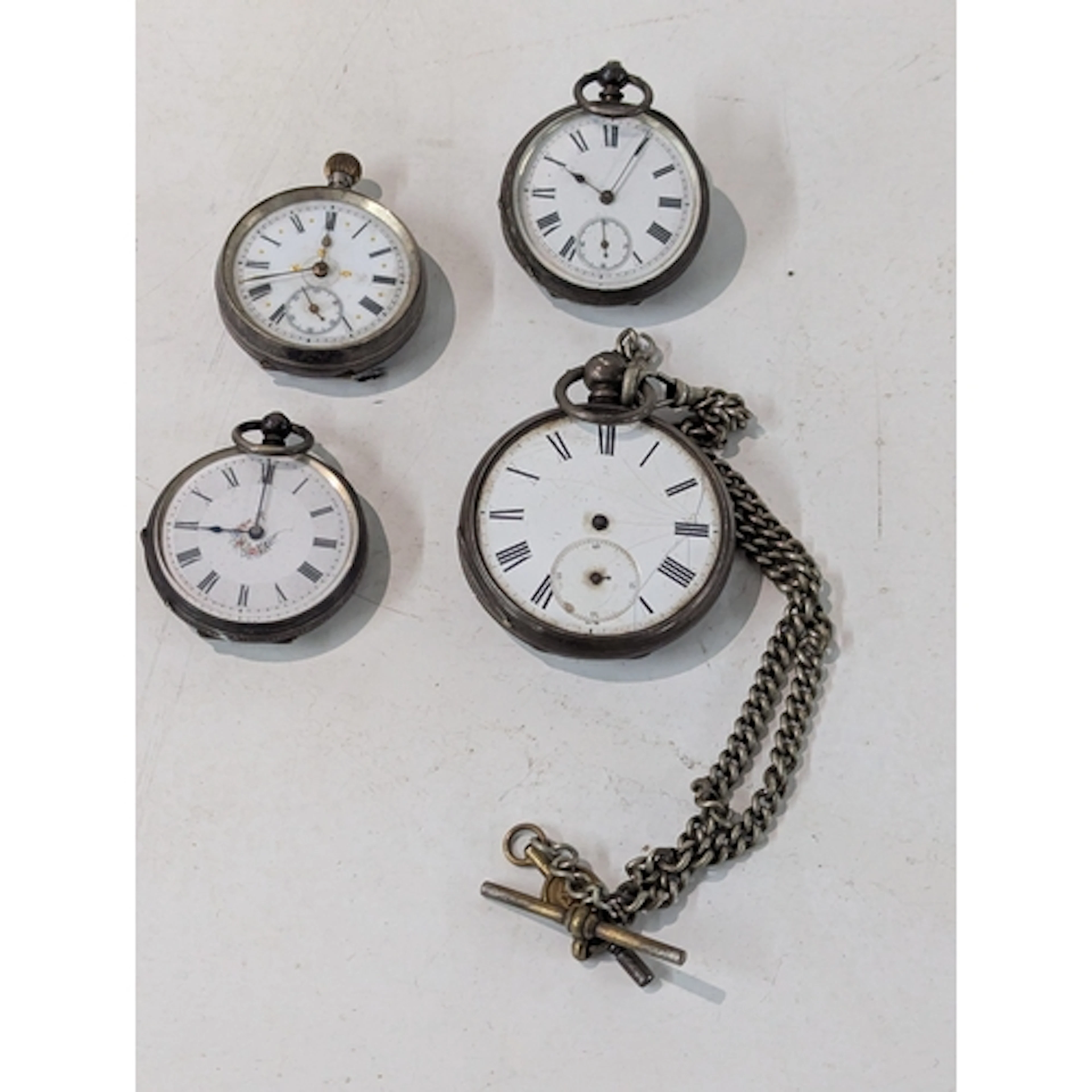 A silver pocket watch A/F, together with three silver cased ...