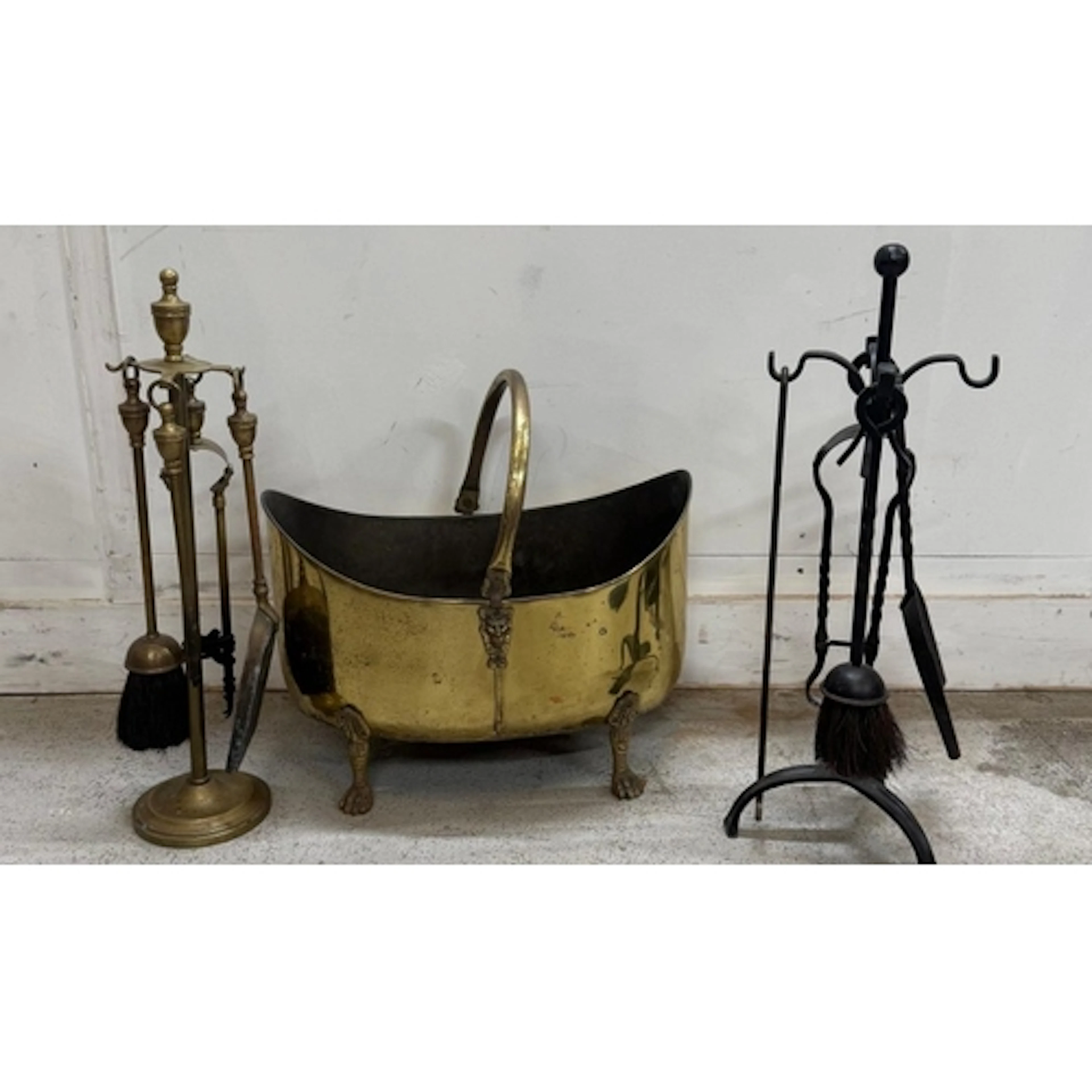 Two fireside companion sets together with a brass coal bucke...