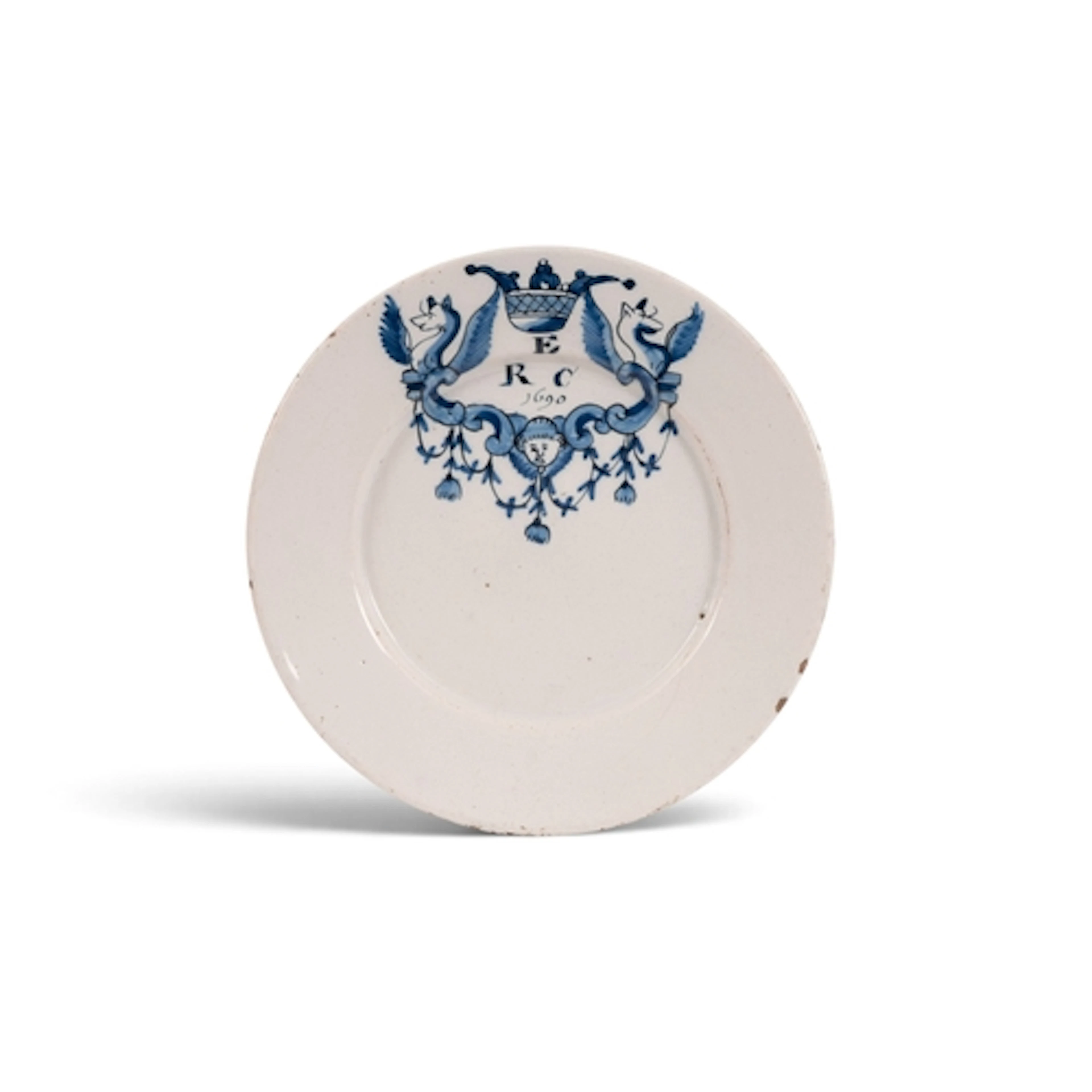 A Delft marriage plate, dated 1690, painted in blue with two...