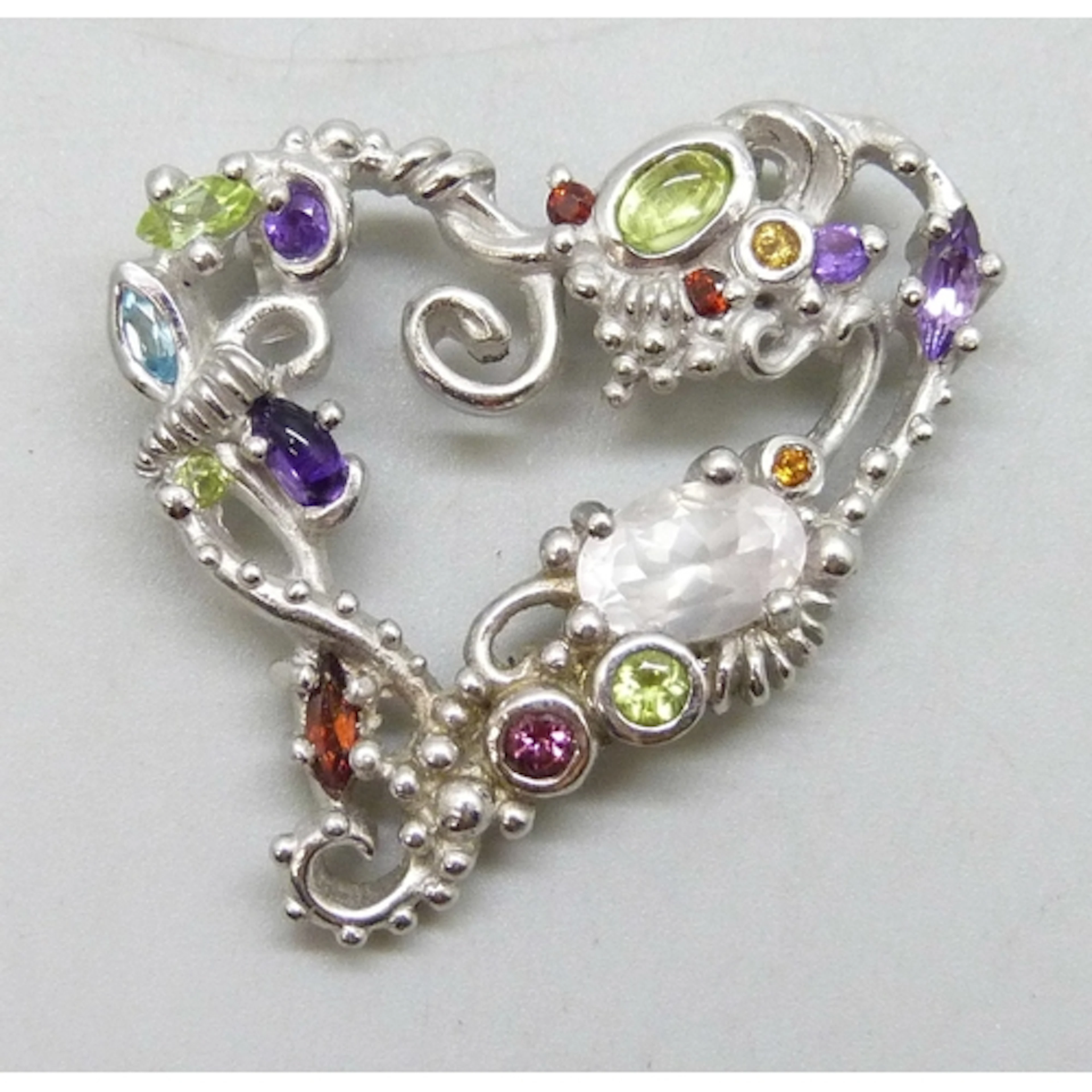A Christian Lacroix silver pendant set with gemstones, hallm...