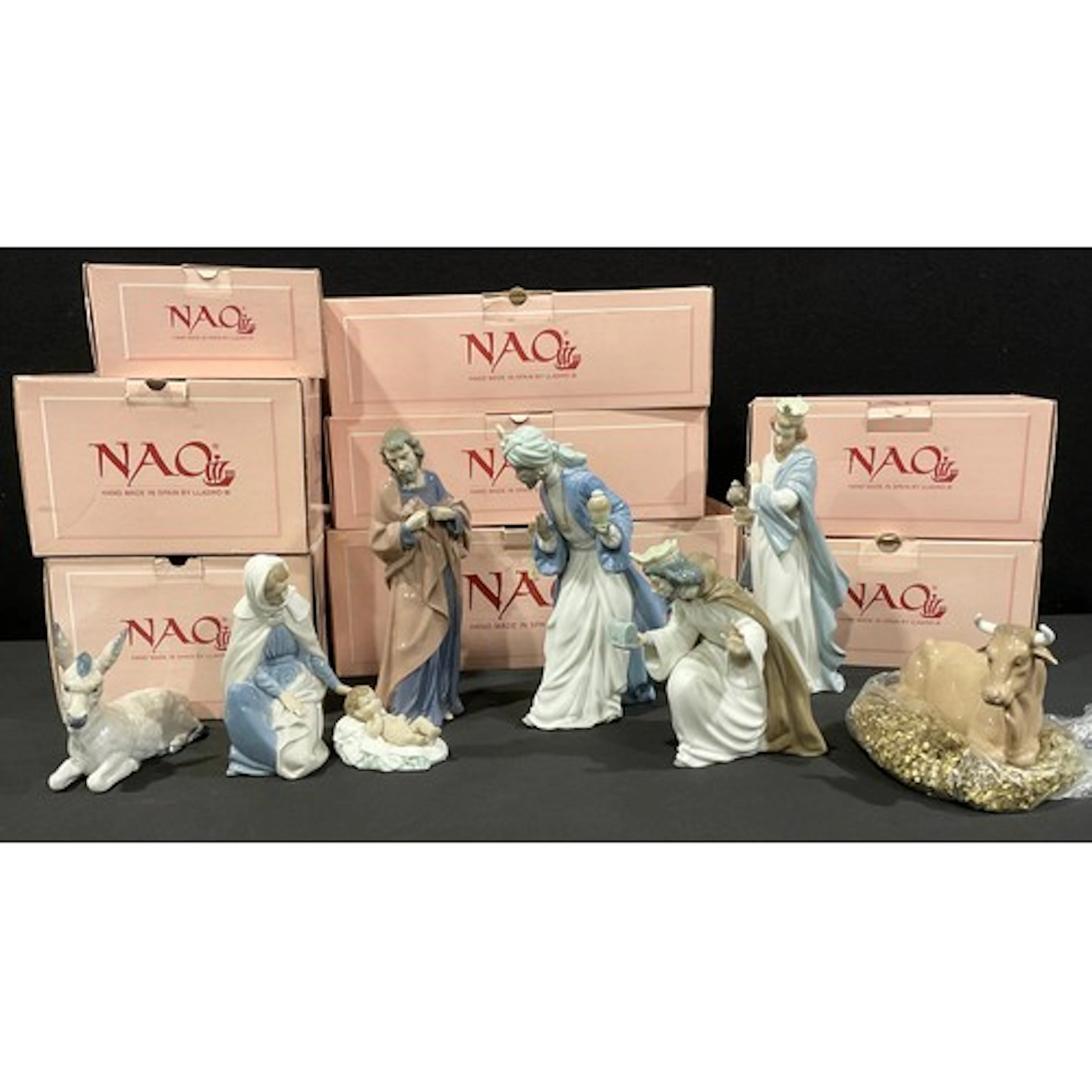 A Nao (by Lladro) porcelain Nativity group, comprising The V...