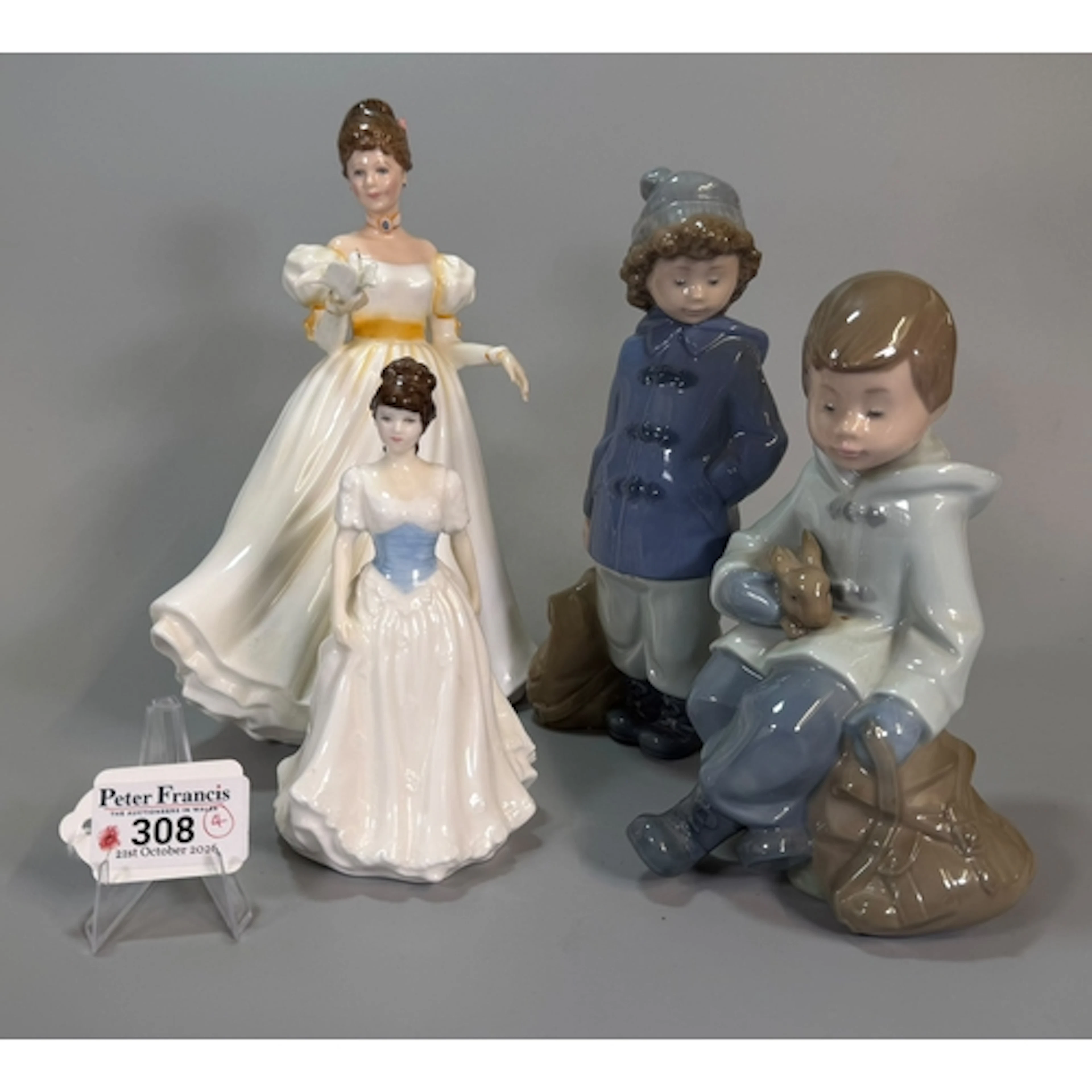 Two Nao Spanish porcelain figurines of young children, toget...