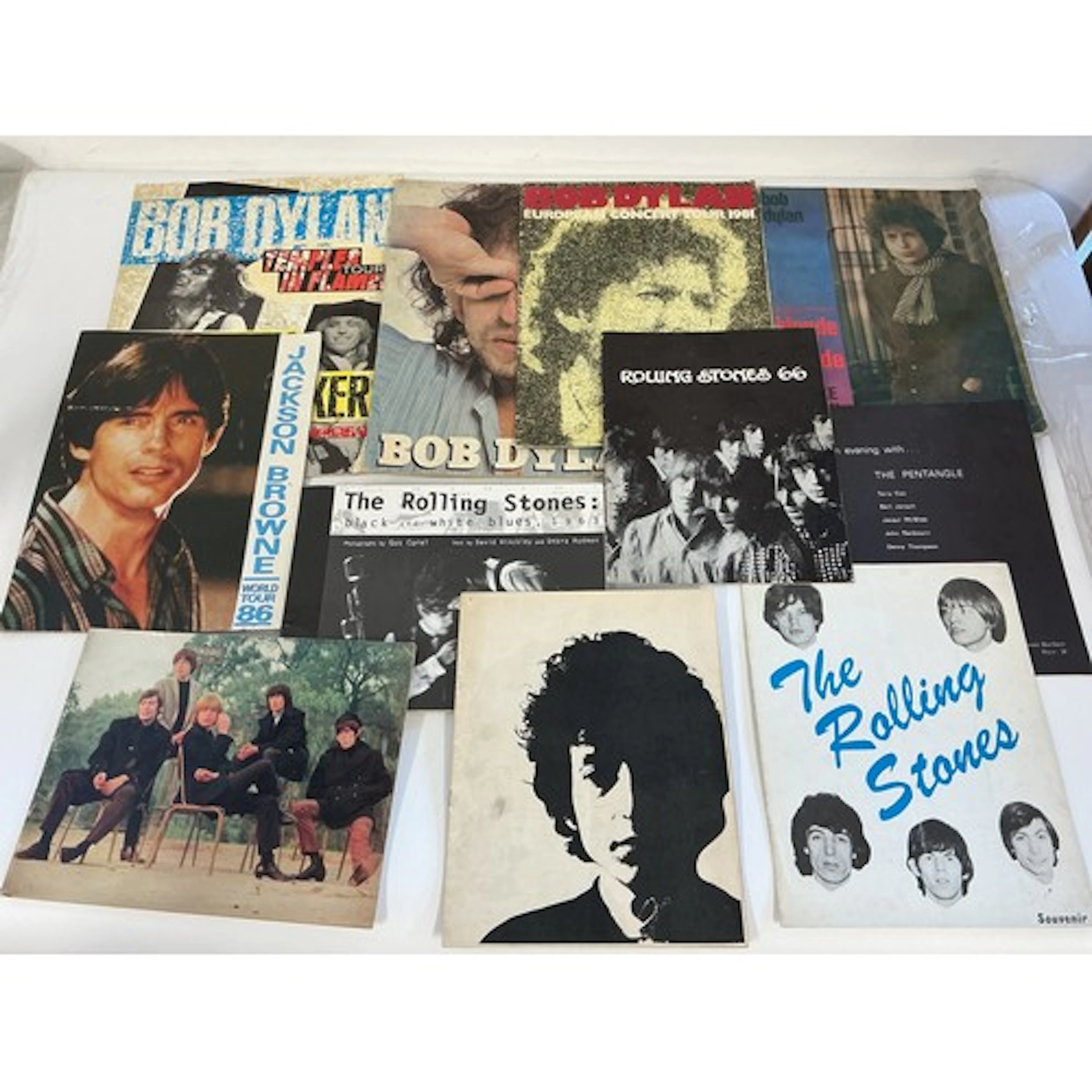 A collection of mainly 1960s tour programs comprising Bob Dy...
