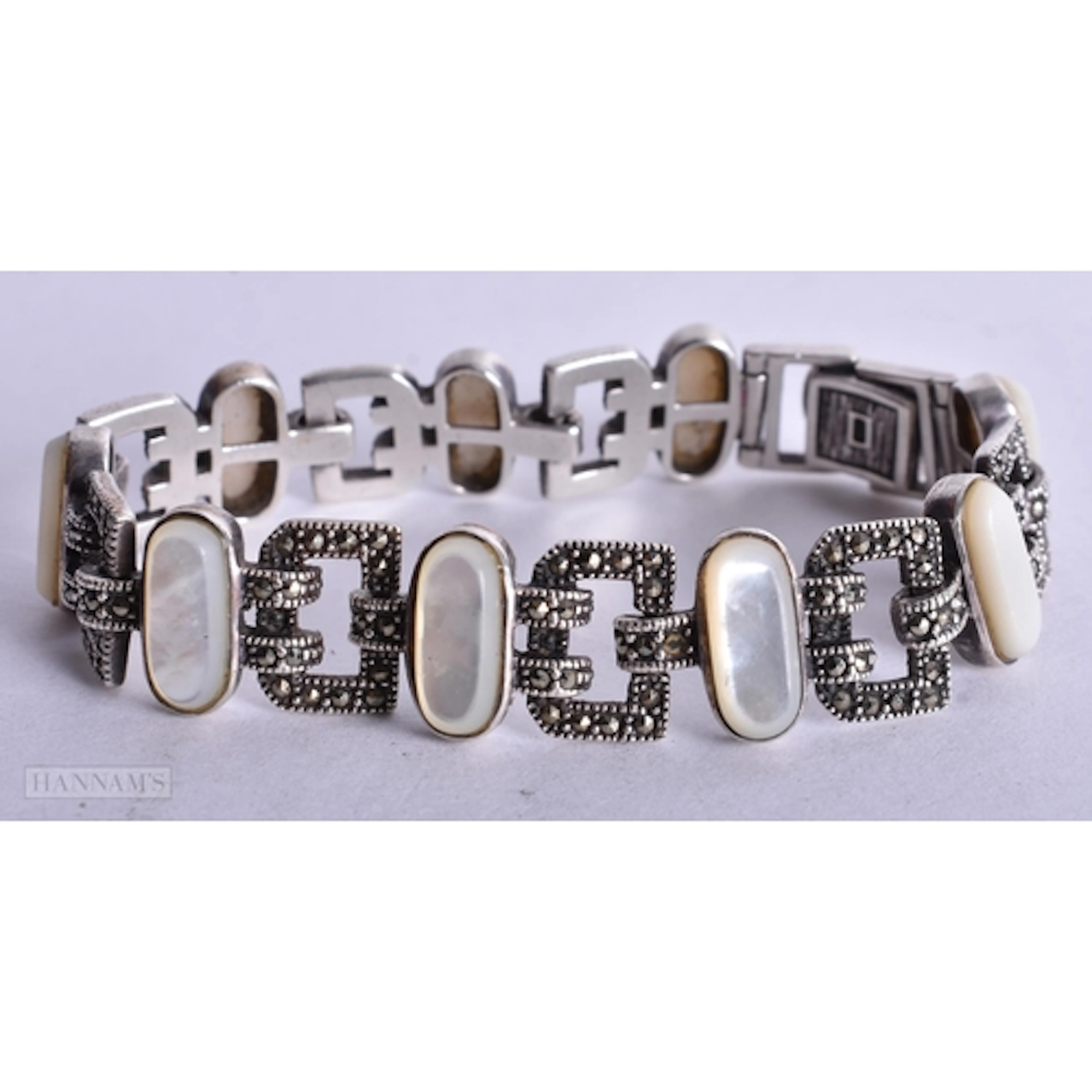 A SILVER MOTHER OF PEARL AND MARCASITE BRACELET. 34.7 grams....