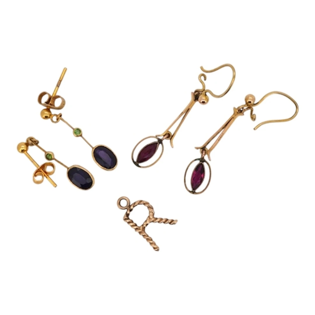 Two pairs of earrings and a pendant, comprising: a pair of g...