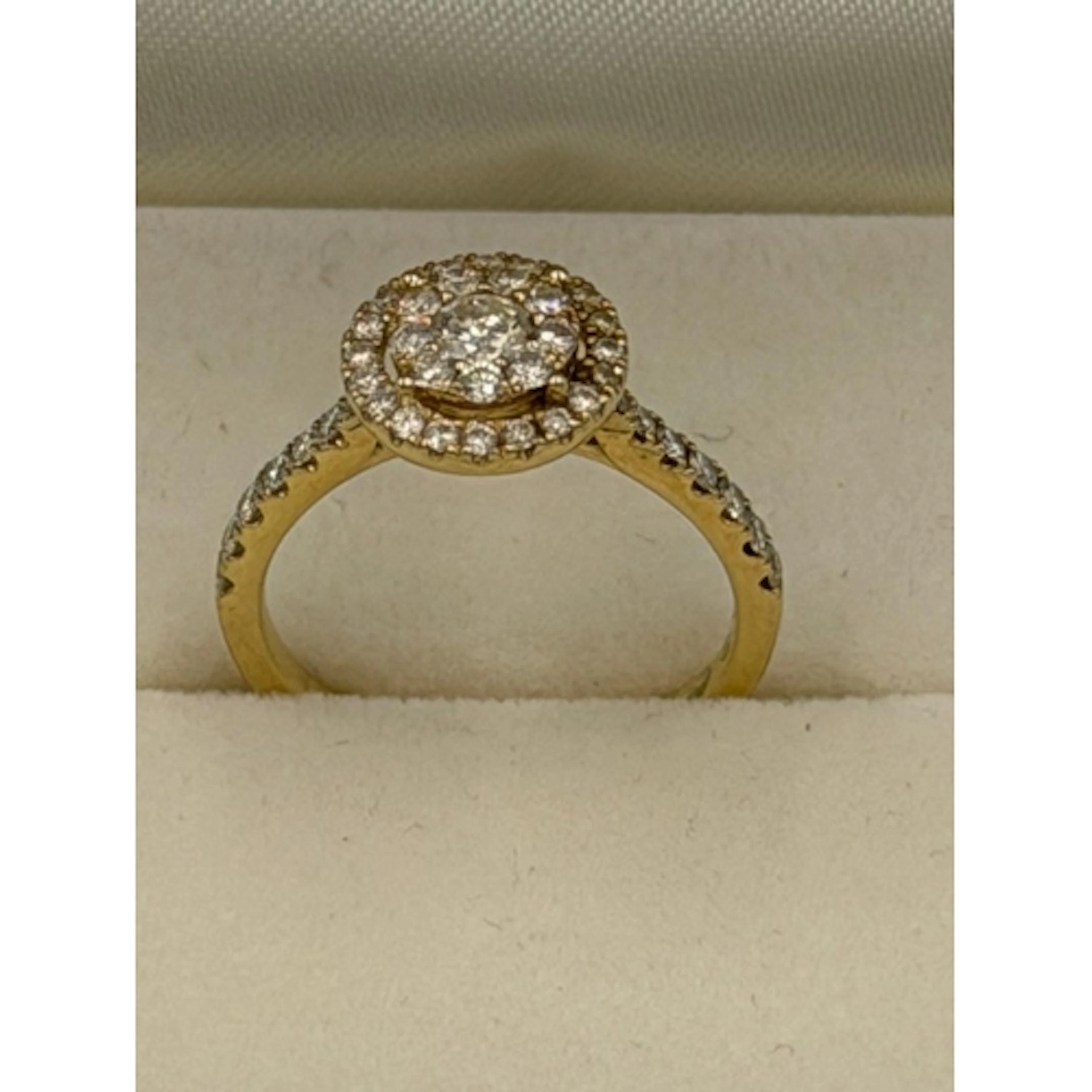 A Coster Diamonds of Amsterdam 18ct yellow gold halo diamond...