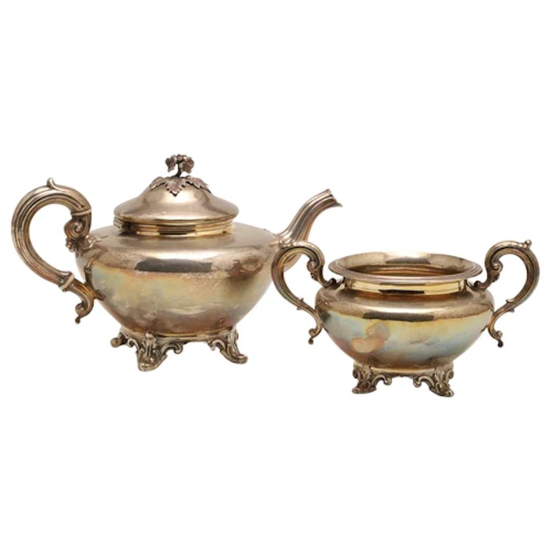 A VICTORIAN SILVER TEAPOT AND SUGAR BASIN. Both pieces of ro...