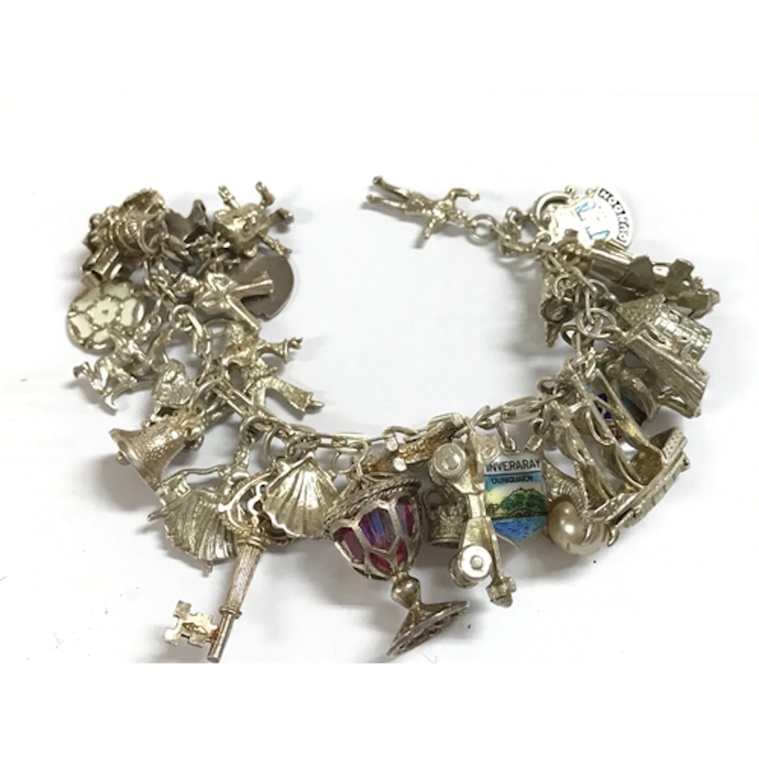 A silver charm bracelet, 66 grams