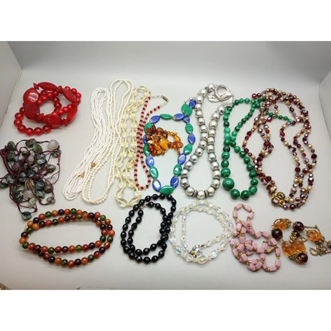 A collection of costume necklaces including vintage