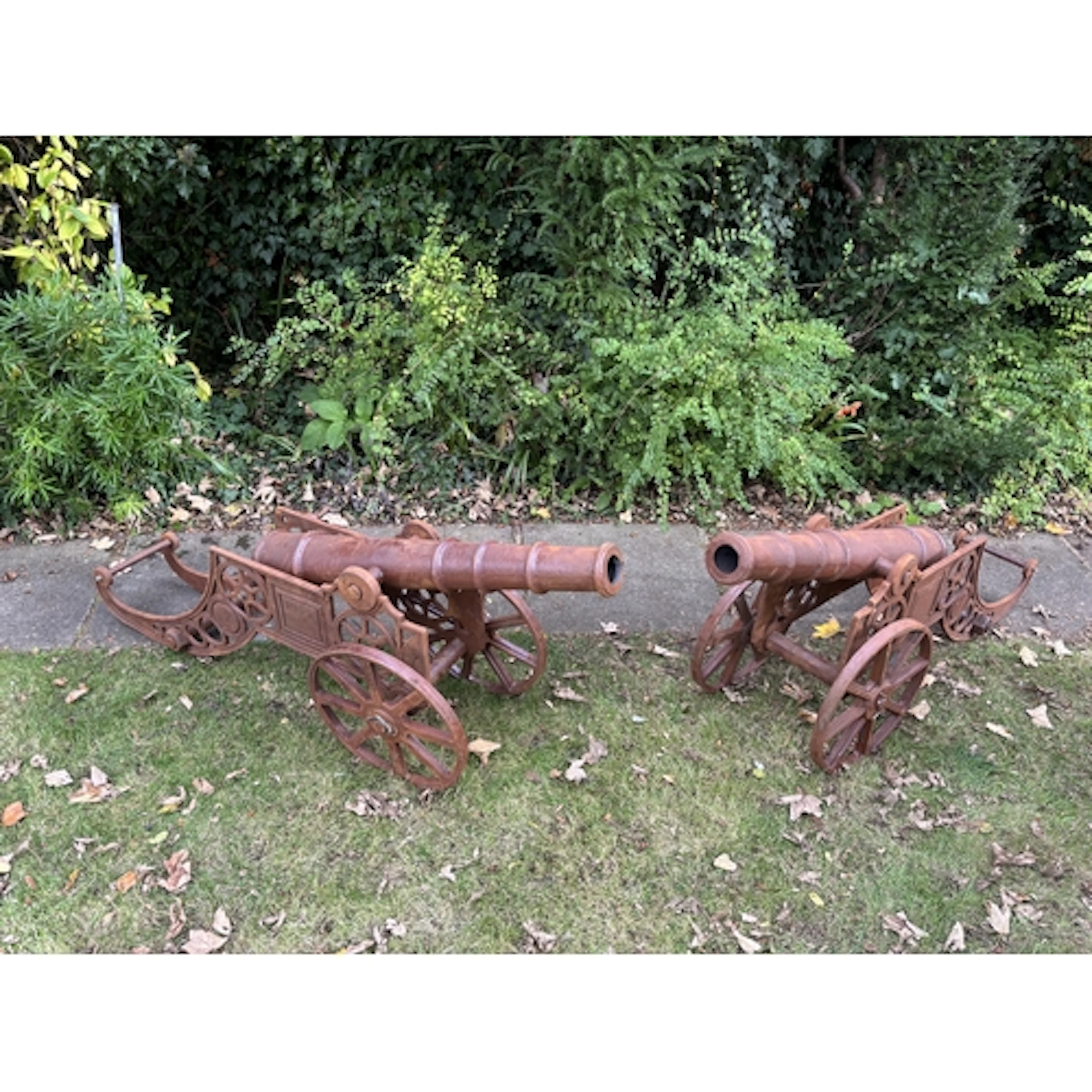 A pair of magnificent and highly decorative cast iron cannon...