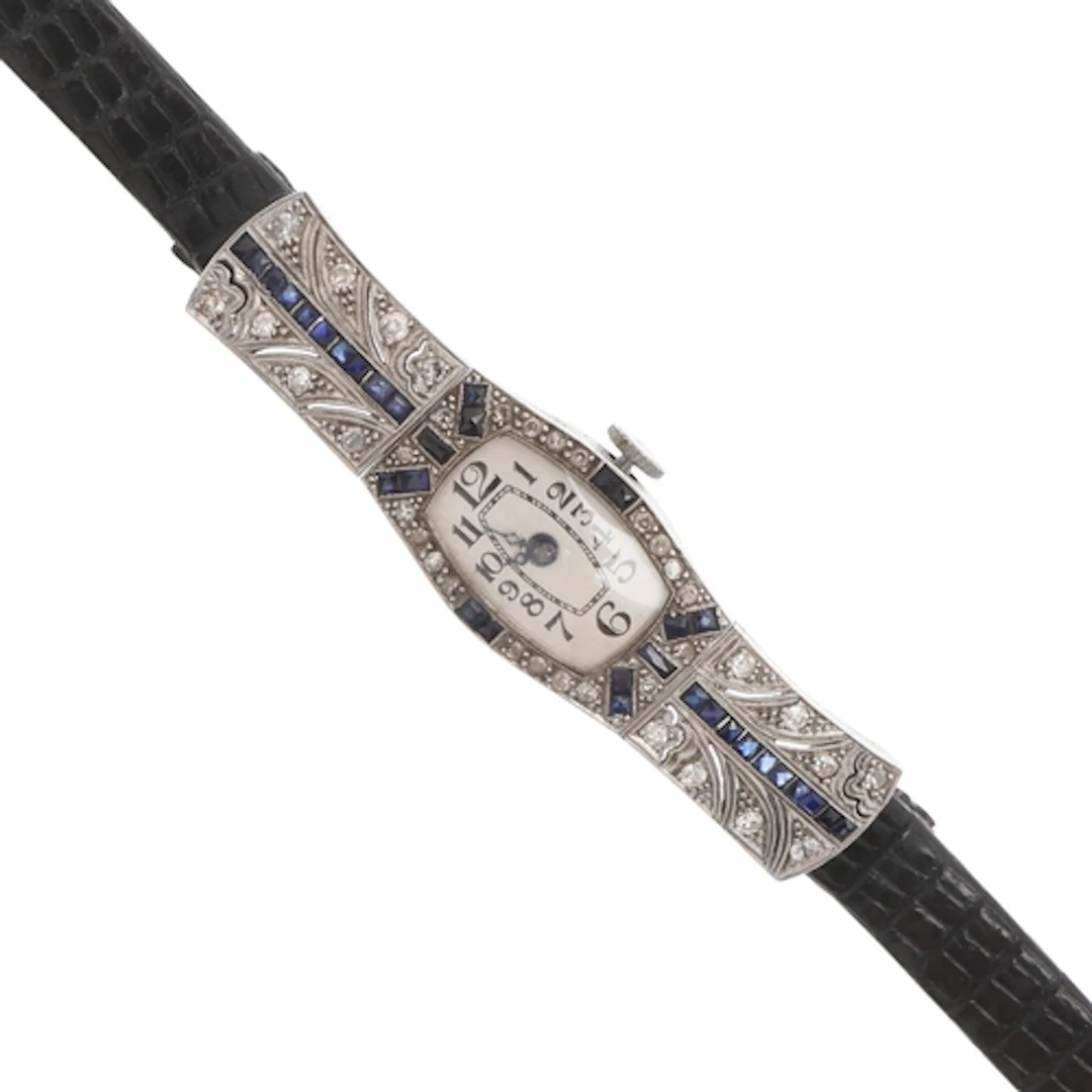 AN ART DECO LADY'S SAPPHIRE AND DIAMOND COCKTAIL WRISTWATCH....