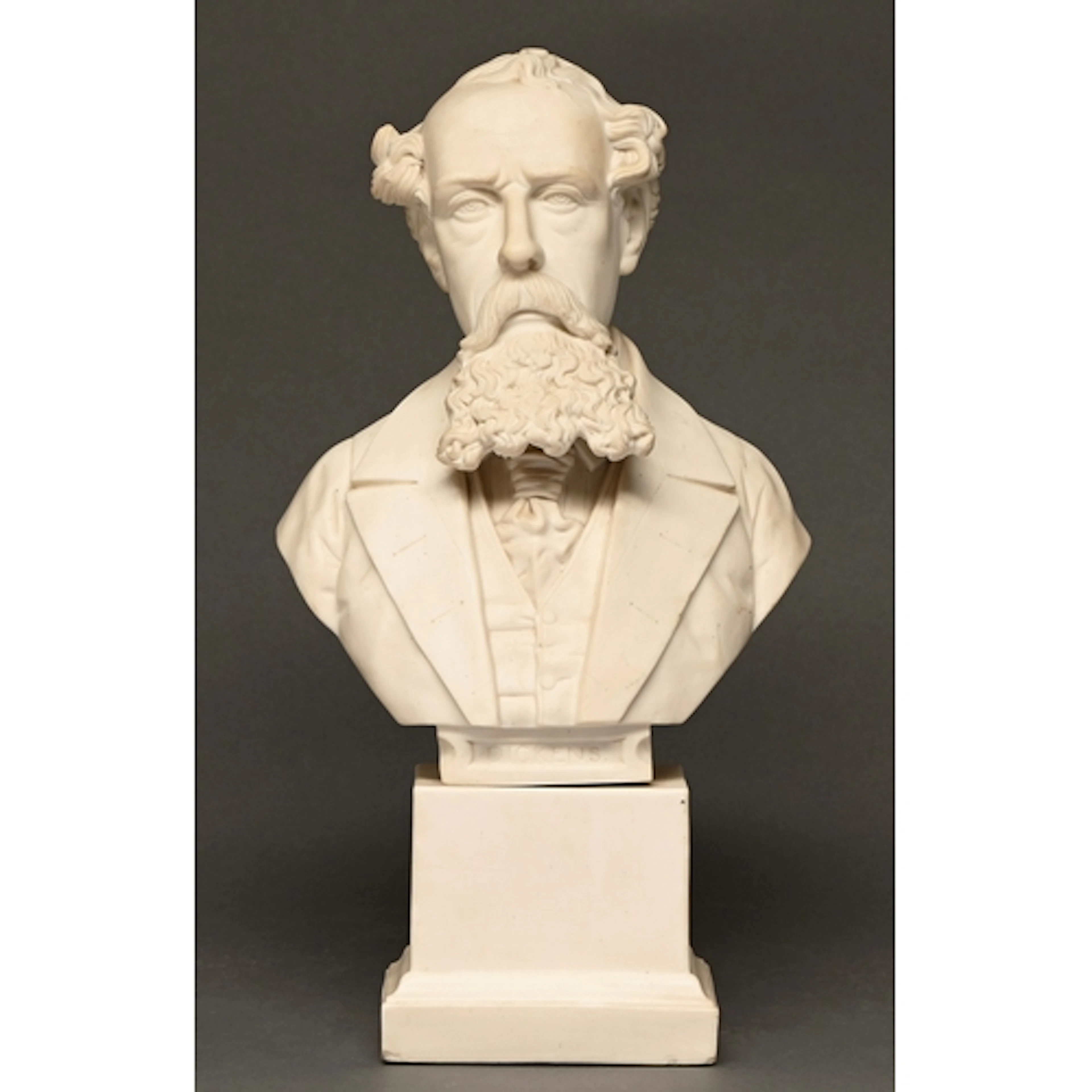 A Victorian parian ware bust of Charles Dickens, on square p...