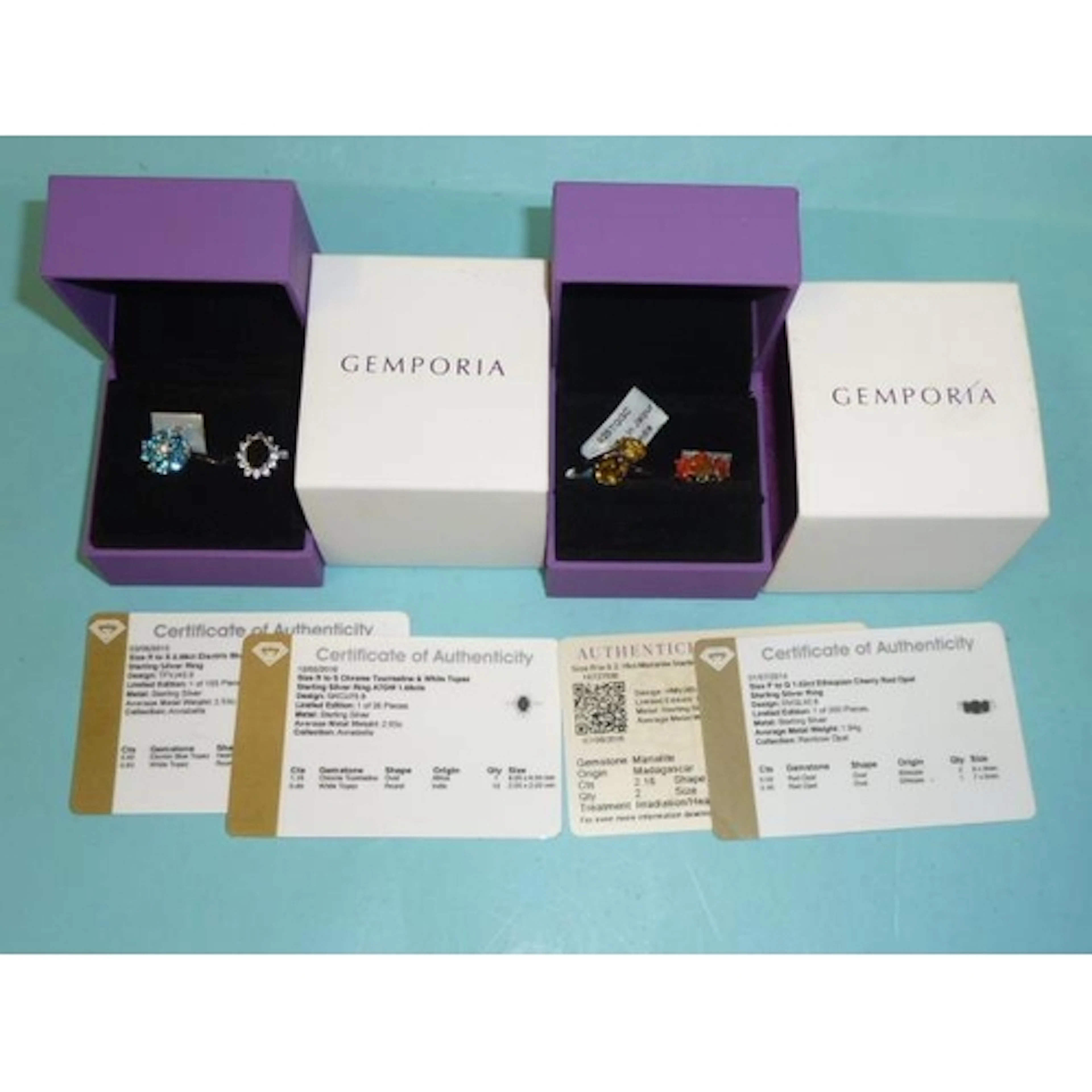 Gemporia, four silver rings set opal, Marialite, tourmaline ...