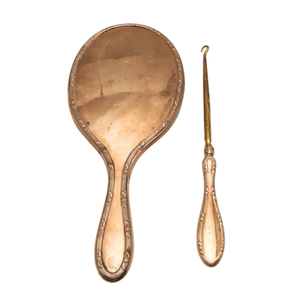 A 9CT GOLD BACKED DRESSING TABLE VANITY MIRROR AND BUTTON HO...
