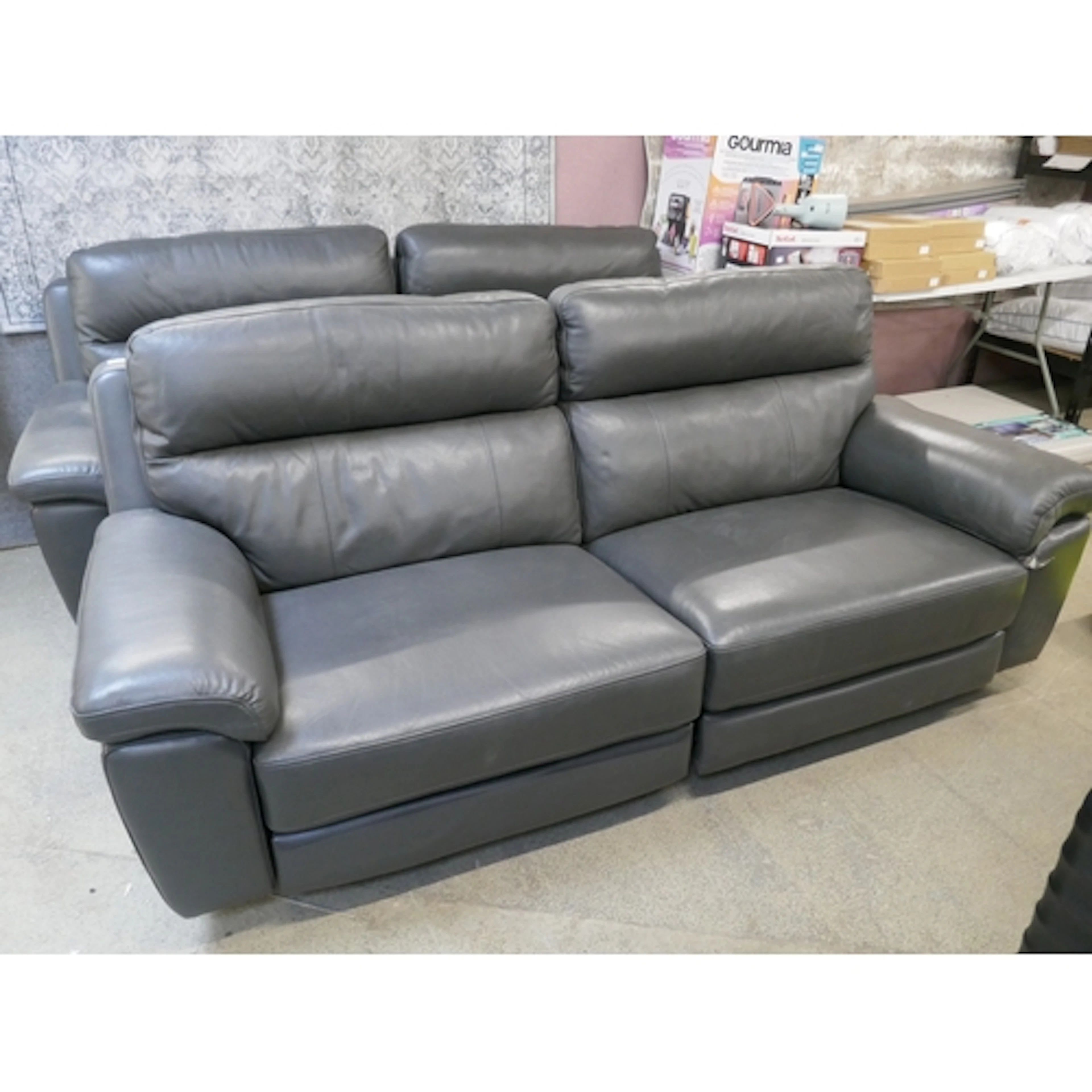 A pair of Grace grey Leather 2.5 seater power reclining sofa...