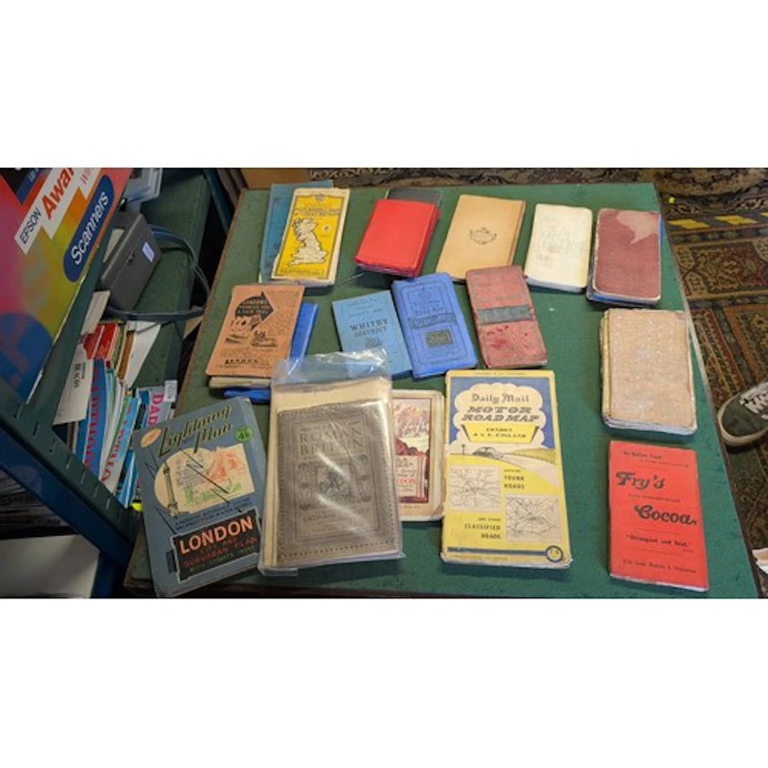 A collection of 20th-century British folding maps and street...