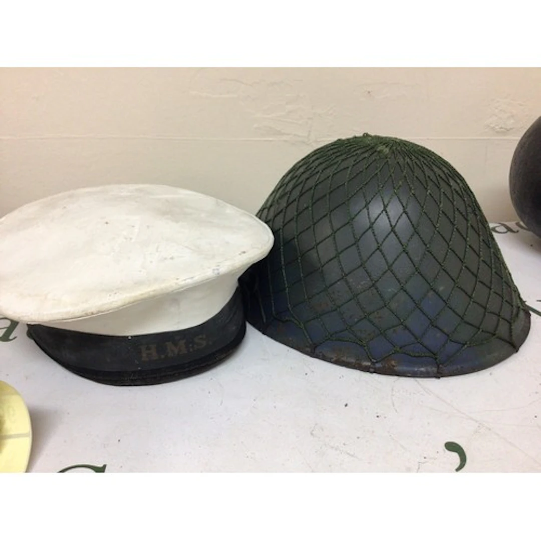 An East German M65 Combat helmet and a British Navy sailors ...