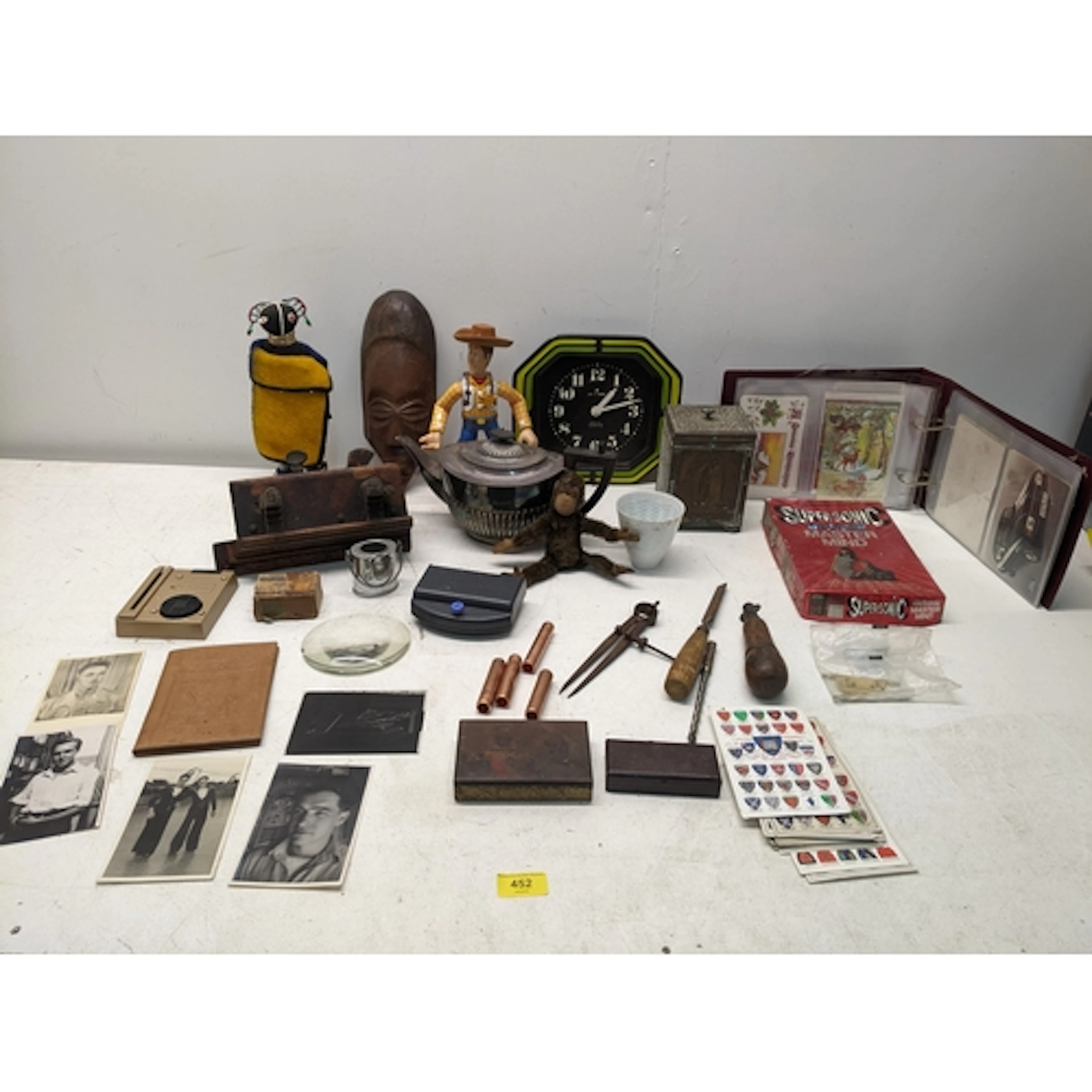 A mixed lot to include a postcard album, African tribal art,...