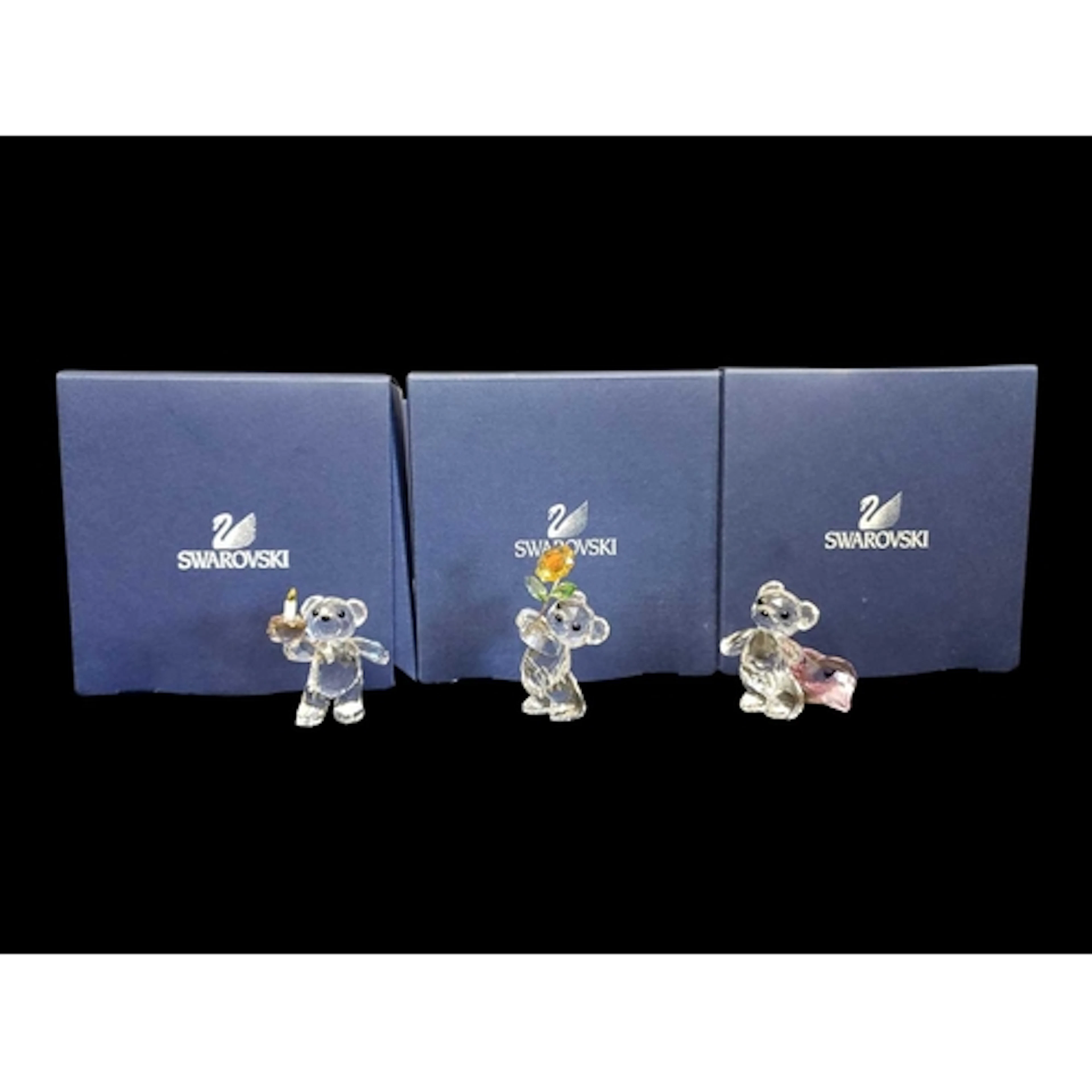 Swarovski - Three boxed 21st century crystal glass Kris Bear...