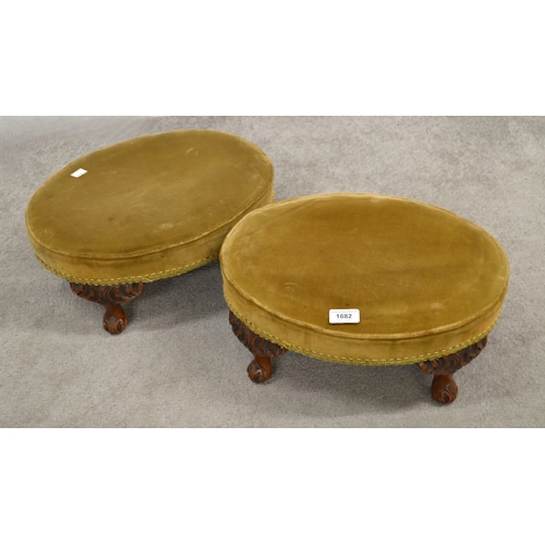 Pair of oval upholstered footstools, on walnut carved cabrio...