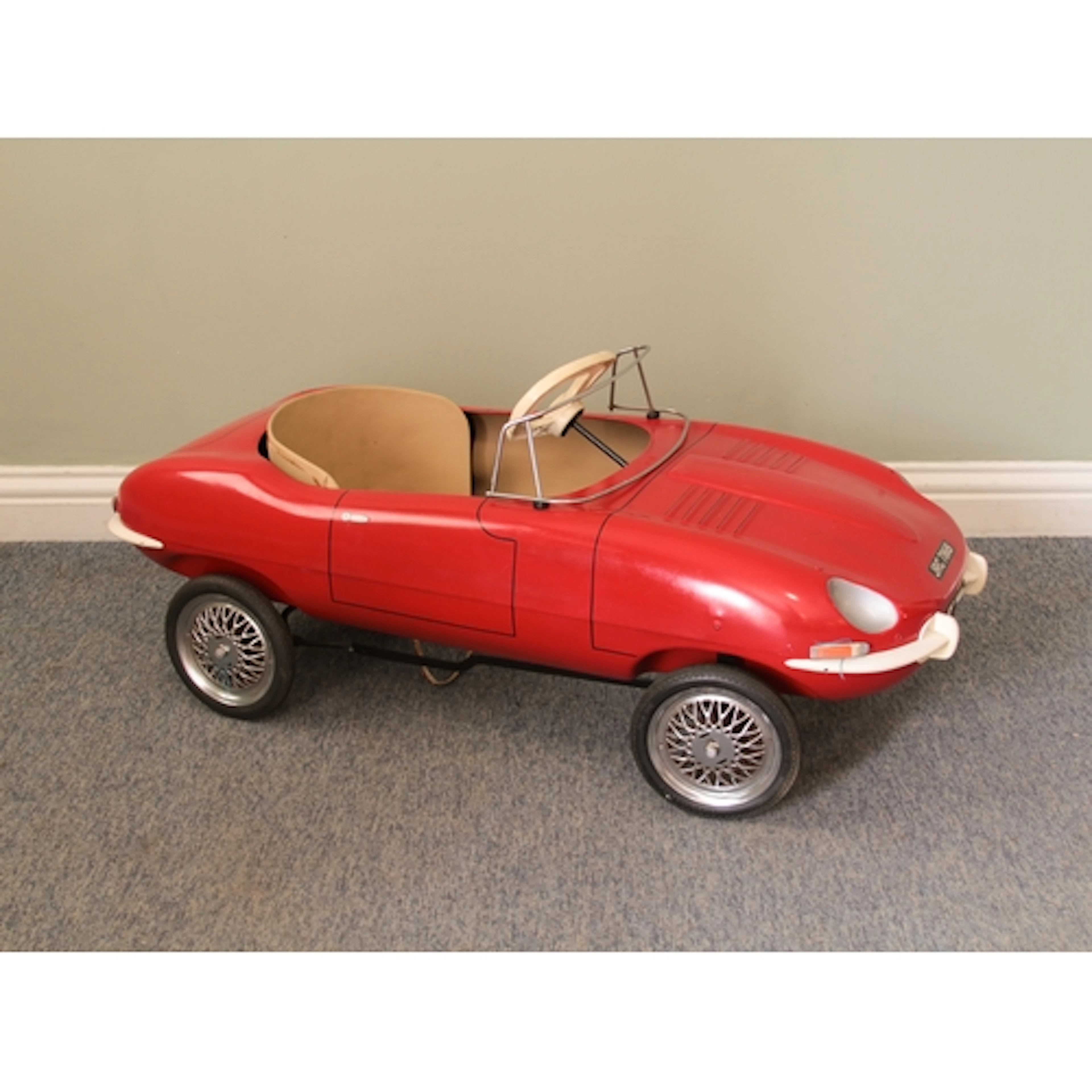 A 1960s Triang Jaguar E-Type pedal car - pressed steel body,...