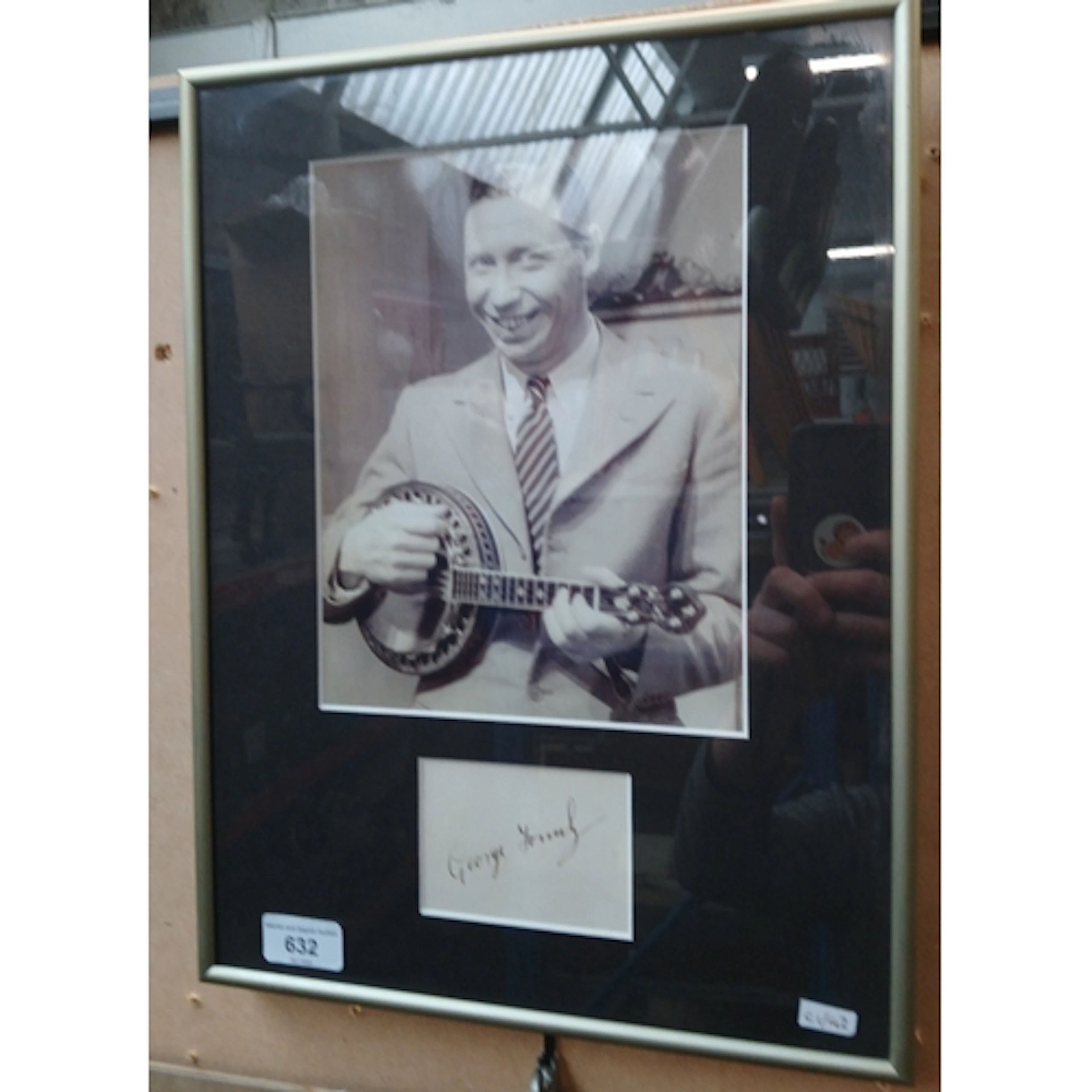 A framed autograph and photo of George Formby.