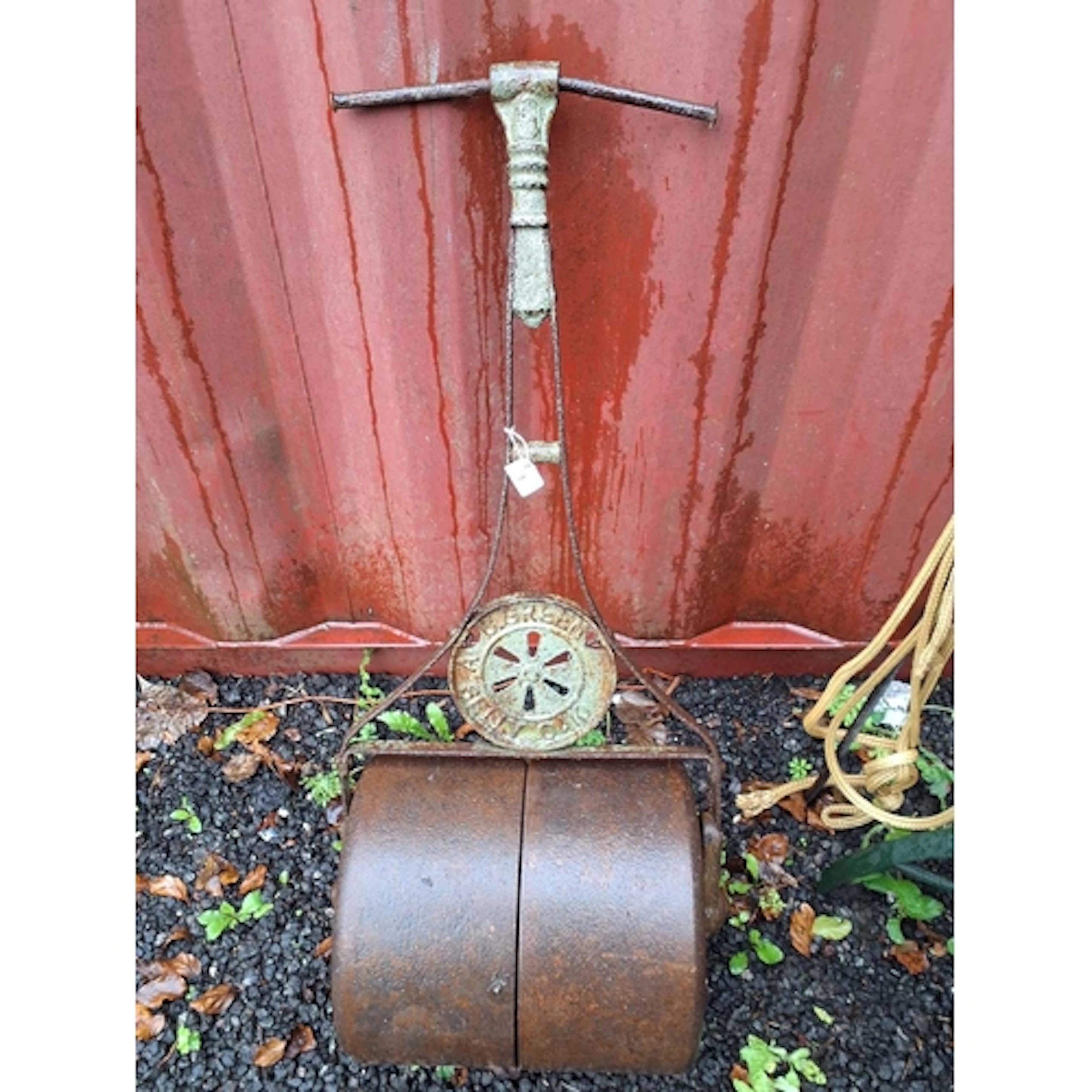 A VINTAGE CAST IRON GARDEN ROLLER by C.Green of Selly Oak w...