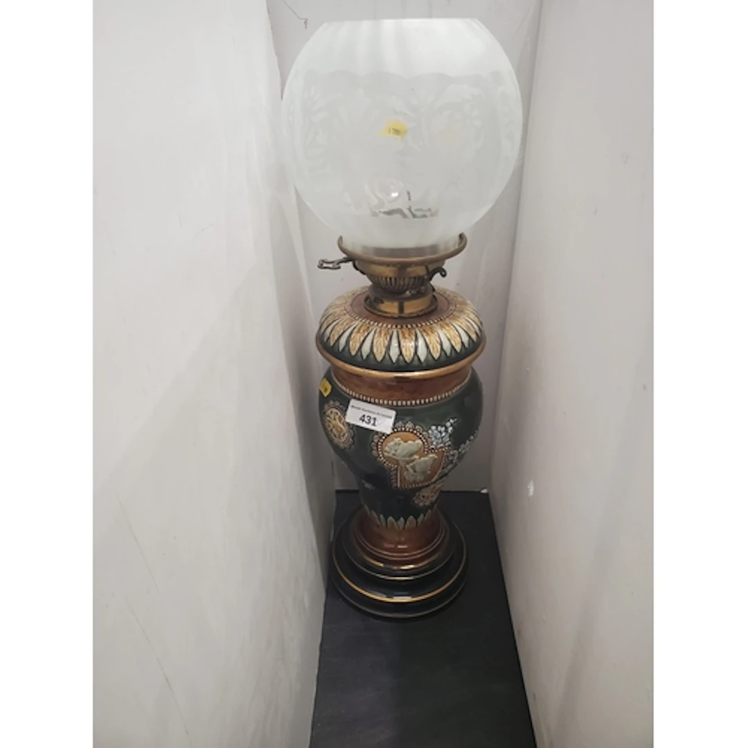 A Doulton Lambeth green glazed Oil Lamp and etched glass sha...