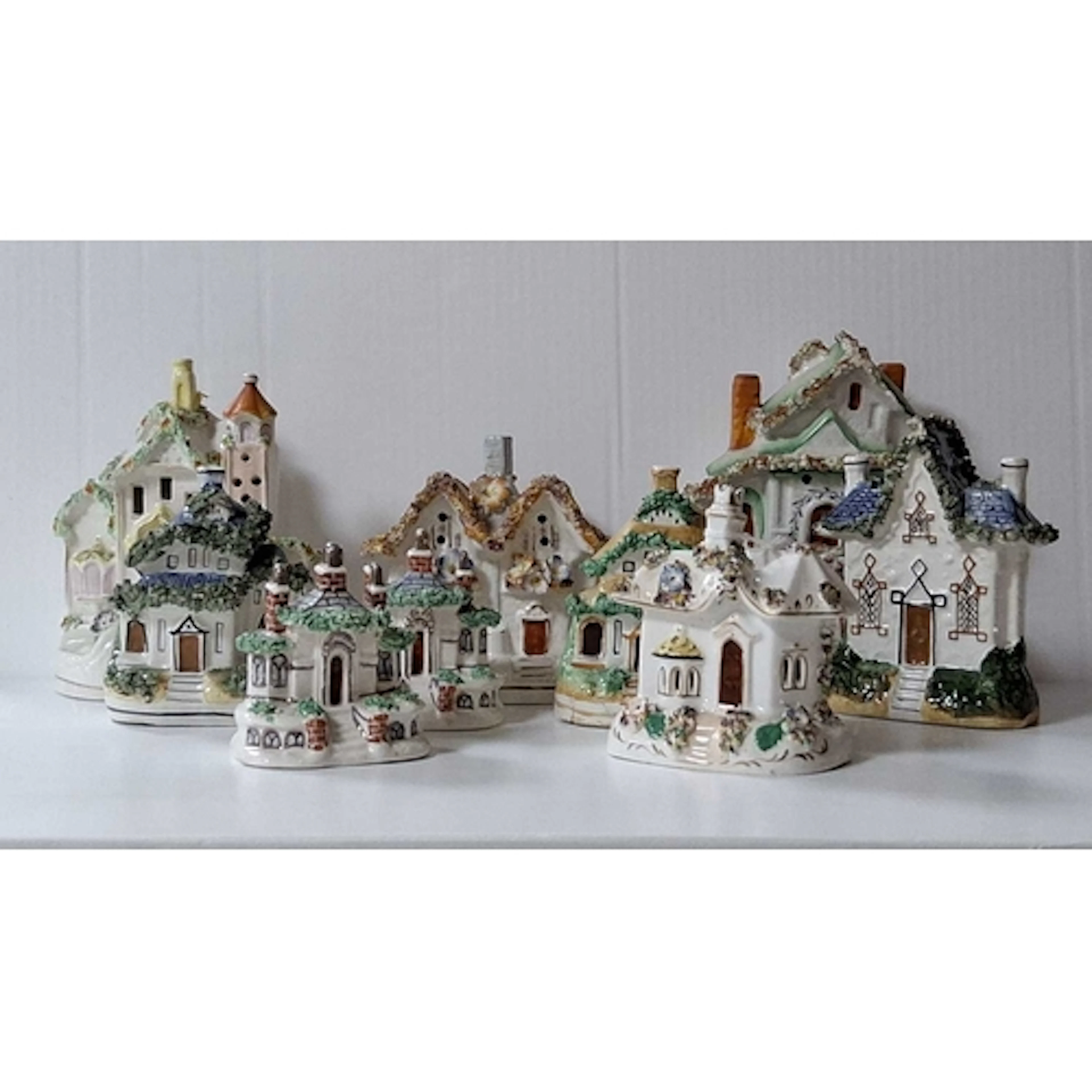 A GROUP OF STAFFORDSHIRE STYLE FLATBACK SCULPTURES, comprisi...