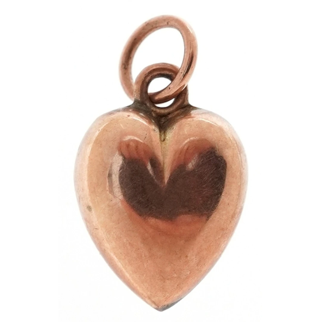9ct rose gold charm in the form of a love heart, 1.3cm high,...