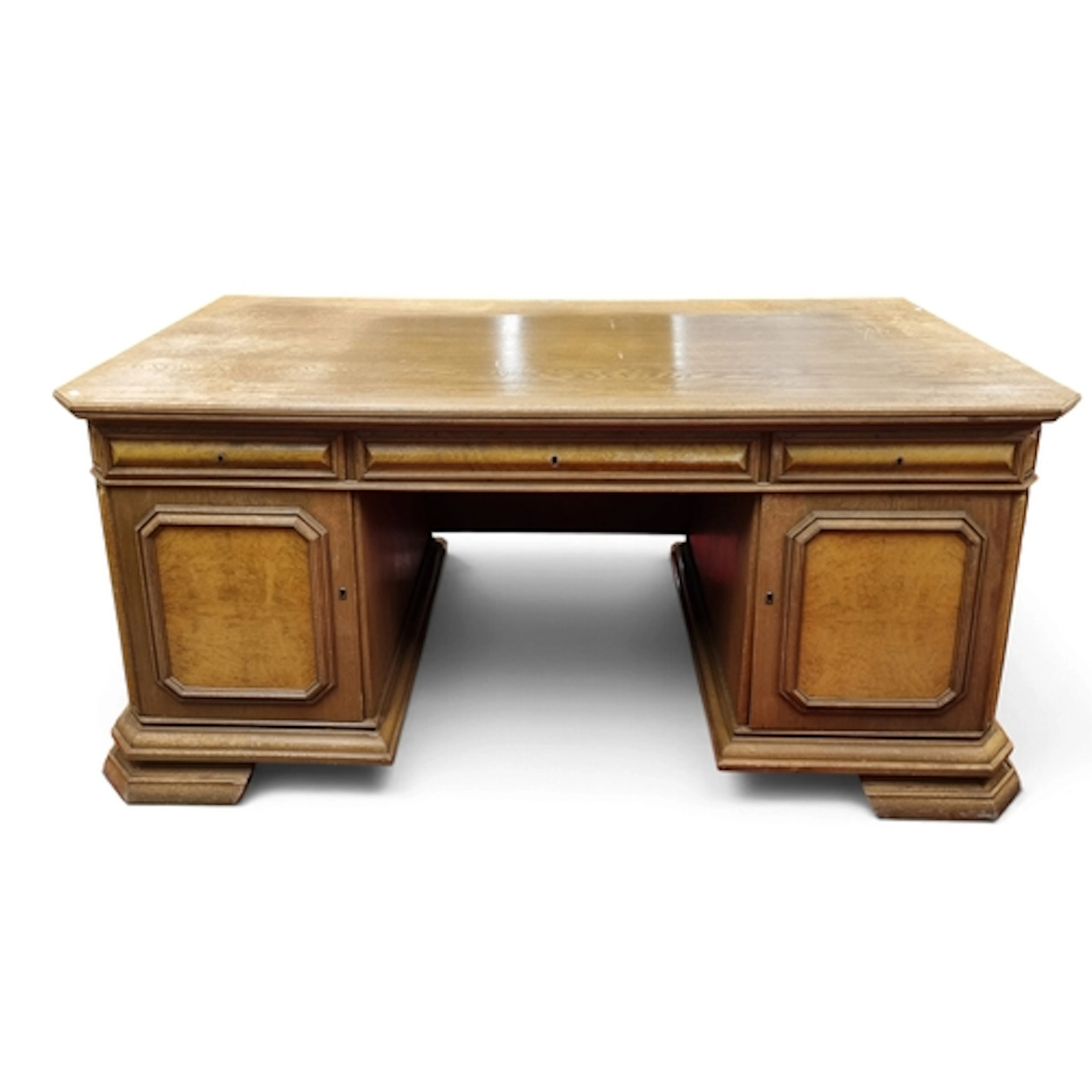A large 20th Century Oak Pedestal Desk with triple frieze dr...