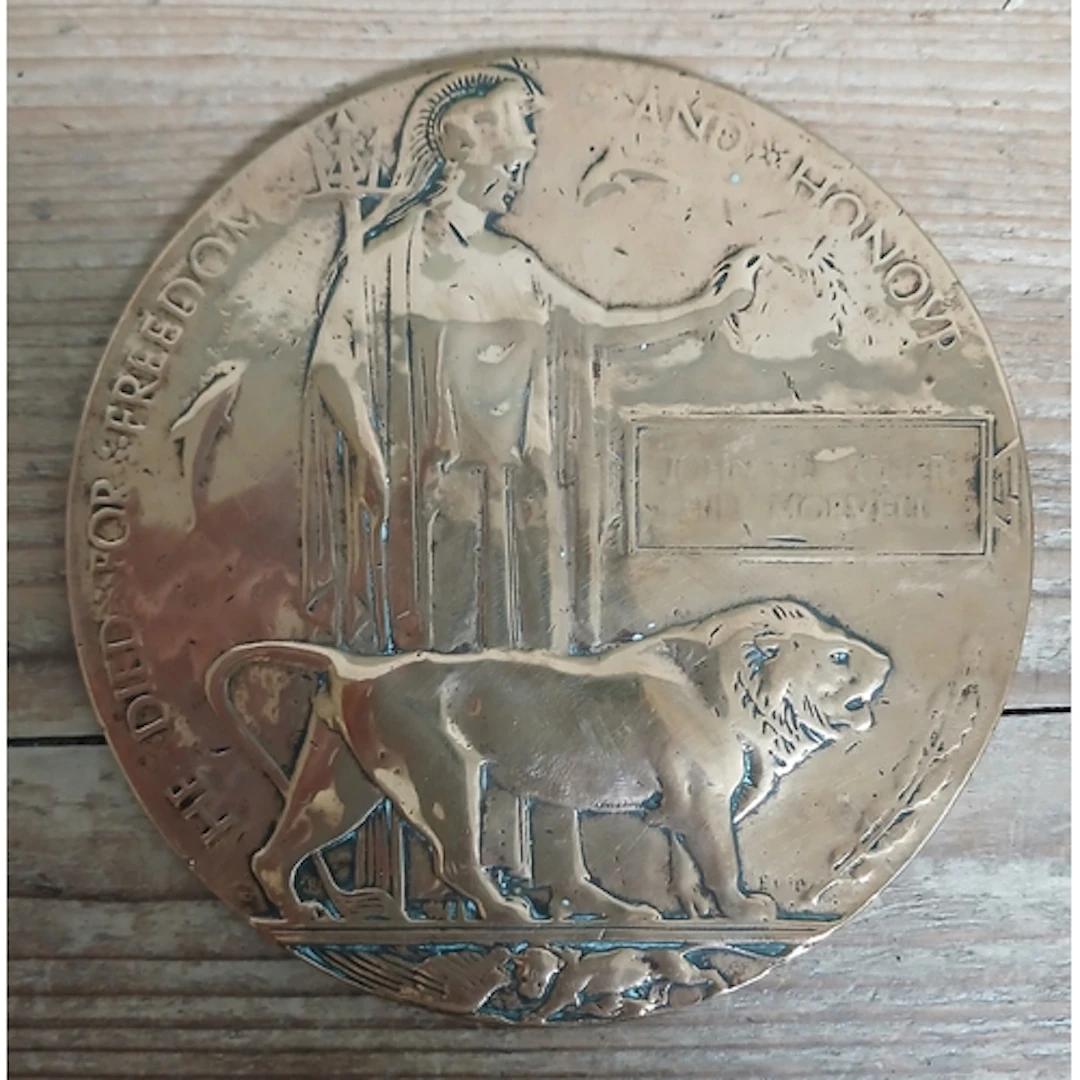 A WWI death plaque in commemoration of John Fletcher Hill Mo...