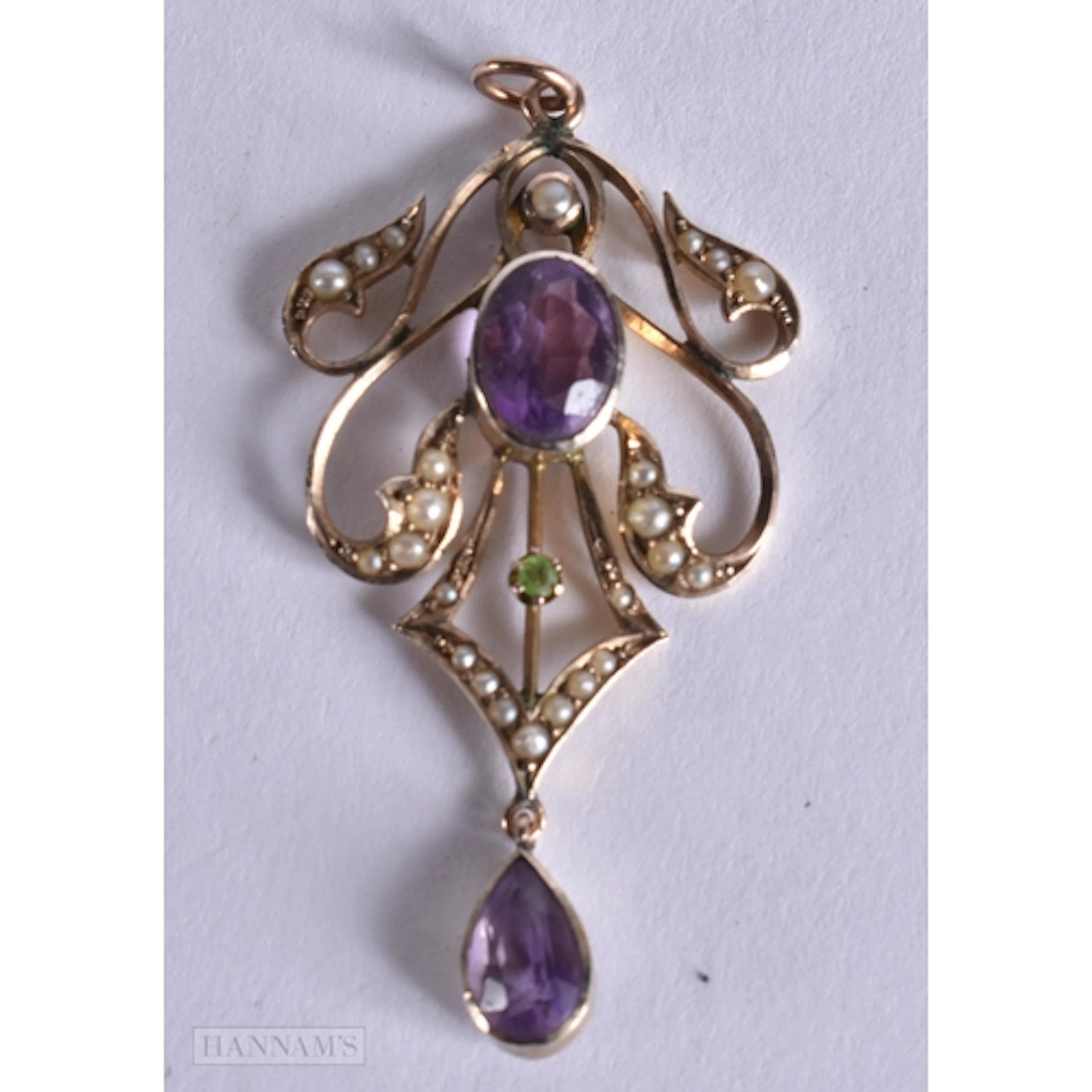 A 9CT GOLD AND AMETHYST PENDANT. 3.3 grams. 4.75 cm x 2.25 c...