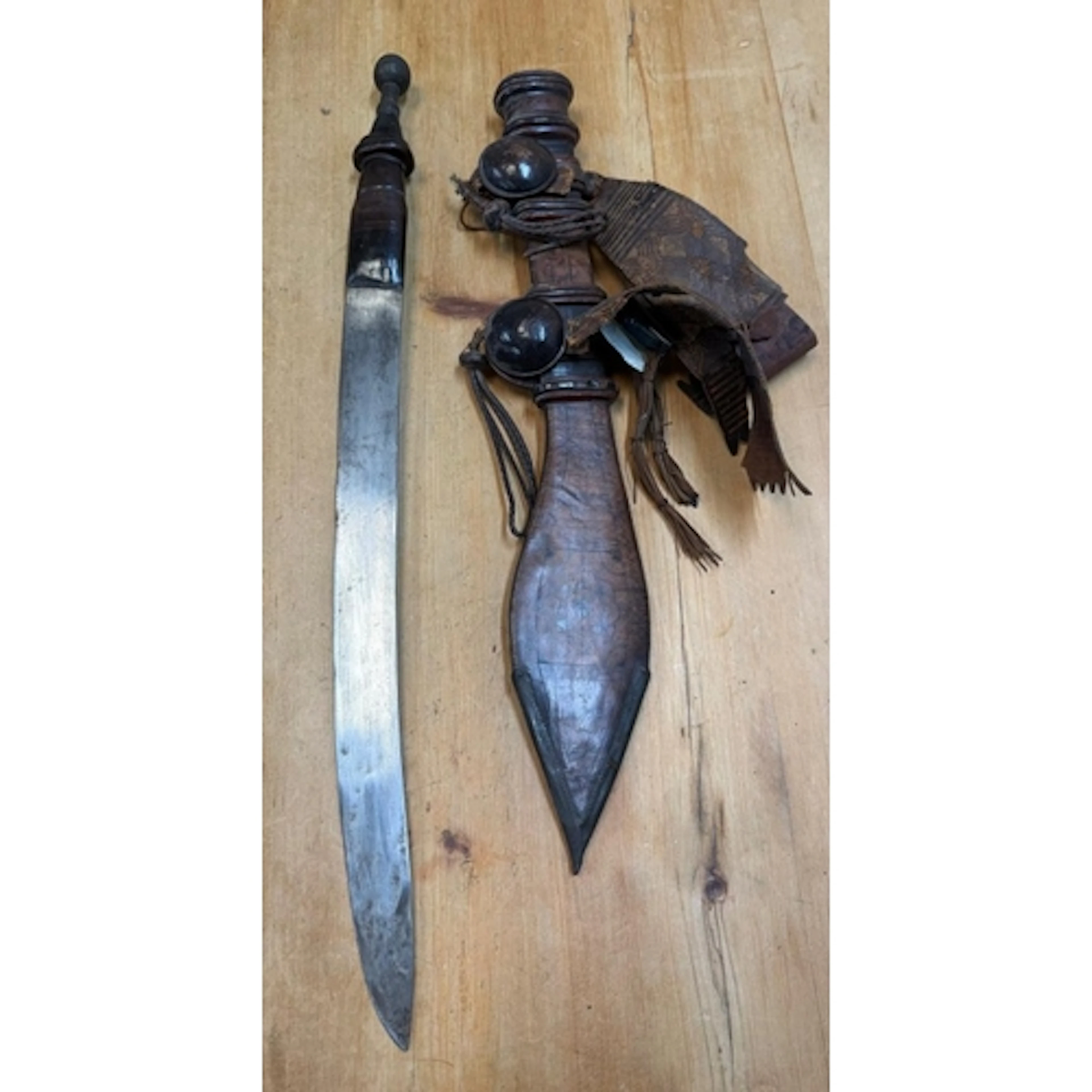 A traditional West African mantirigo sword in a scabbard ...