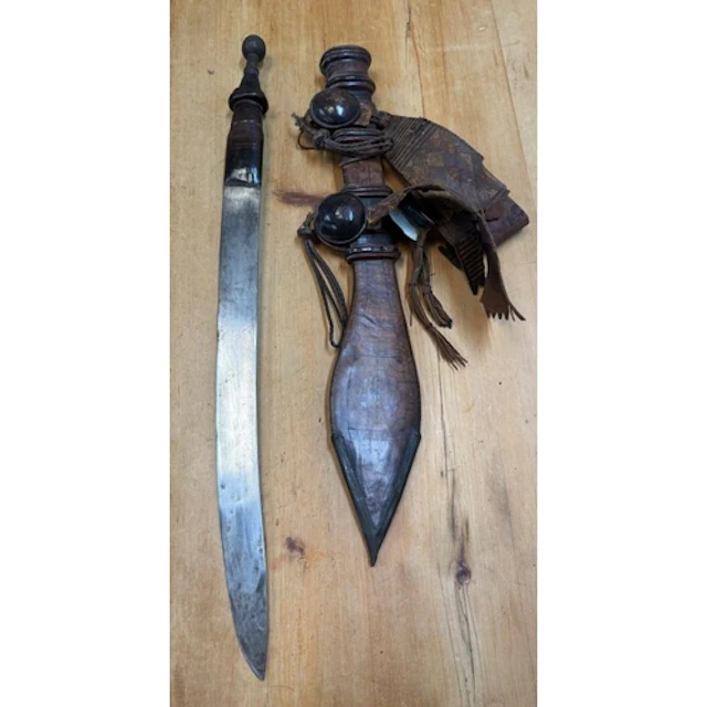 A traditional West African mantirigo sword in a scabbard...