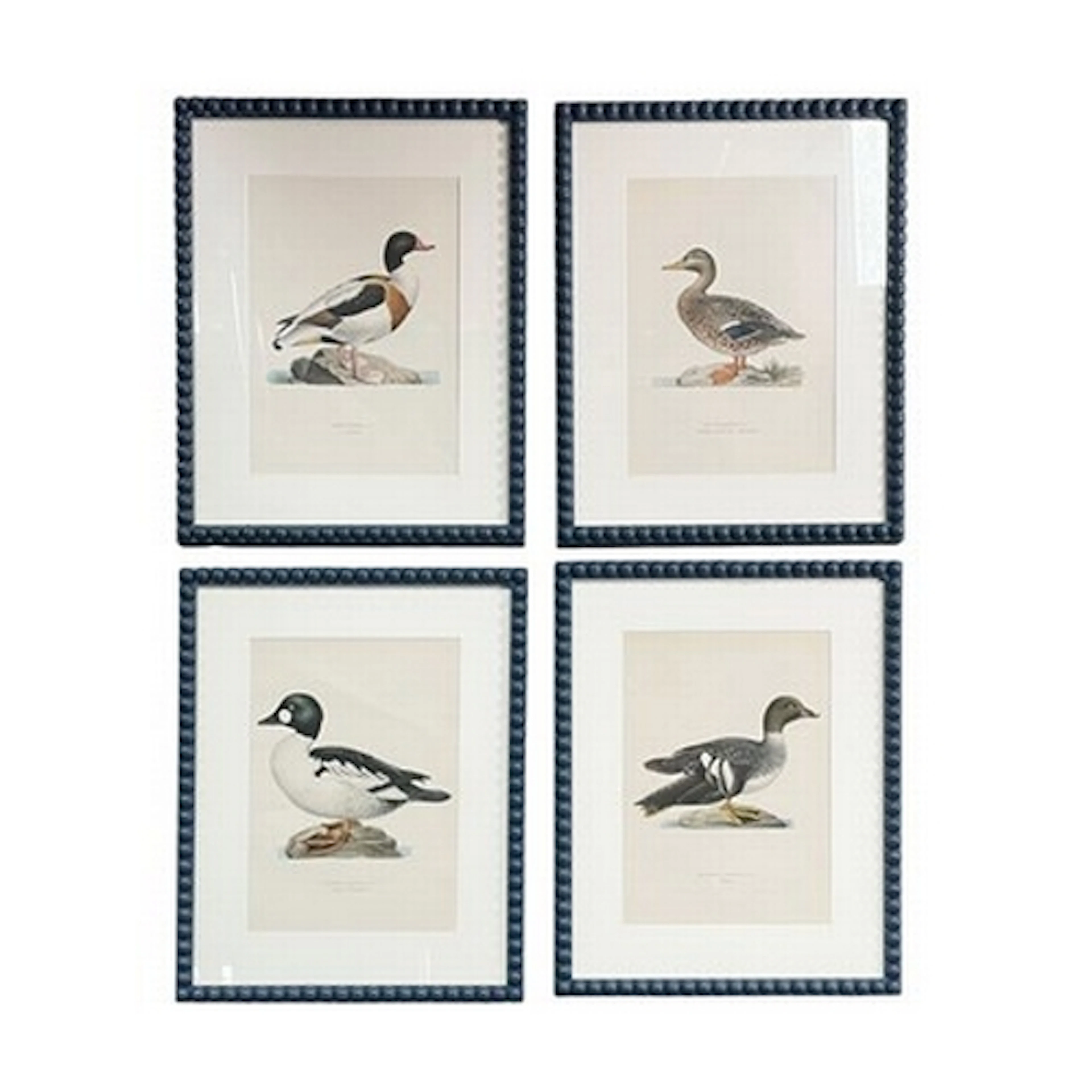 A series of four modern interior designer framed prints depi...