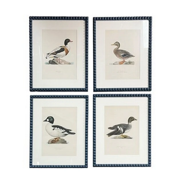 A series of four modern interior designer framed prints depi...